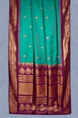 Green Semi Soft Silk Peacock Butta Contrast Pallu Saree