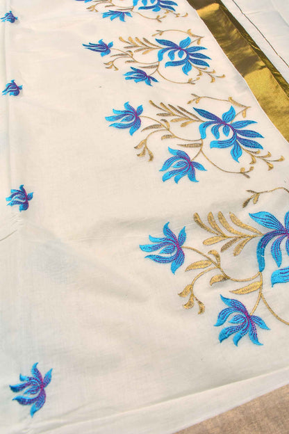 Off White Pure Kerala Cotton Blue Lotus Embroidery Golden Border Saree