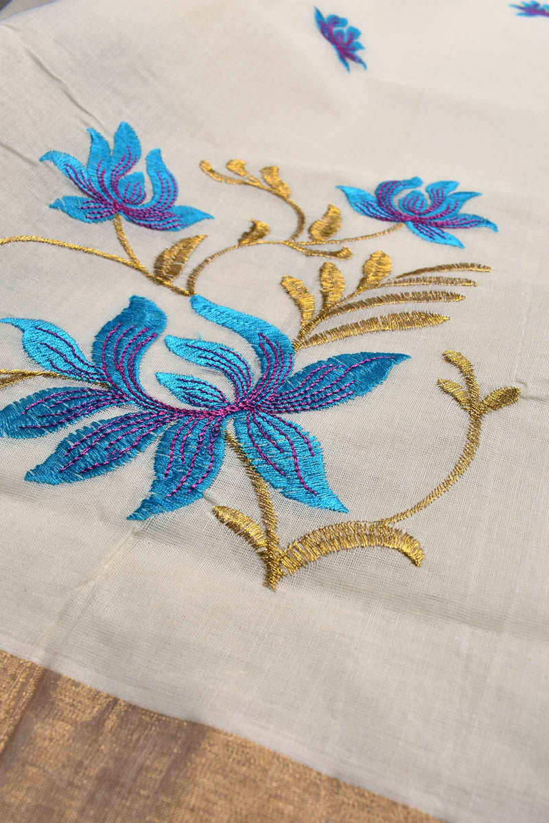 Off White Pure Kerala Cotton Blue Lotus Embroidery Golden Border Saree