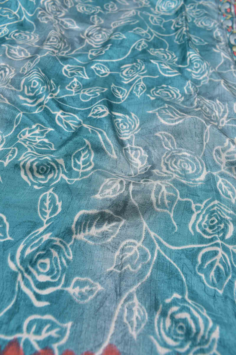 Blue and Grey Semi Dola Rose Garden Printed Kalamkari Pallu Contrast Red Zari Border Saree