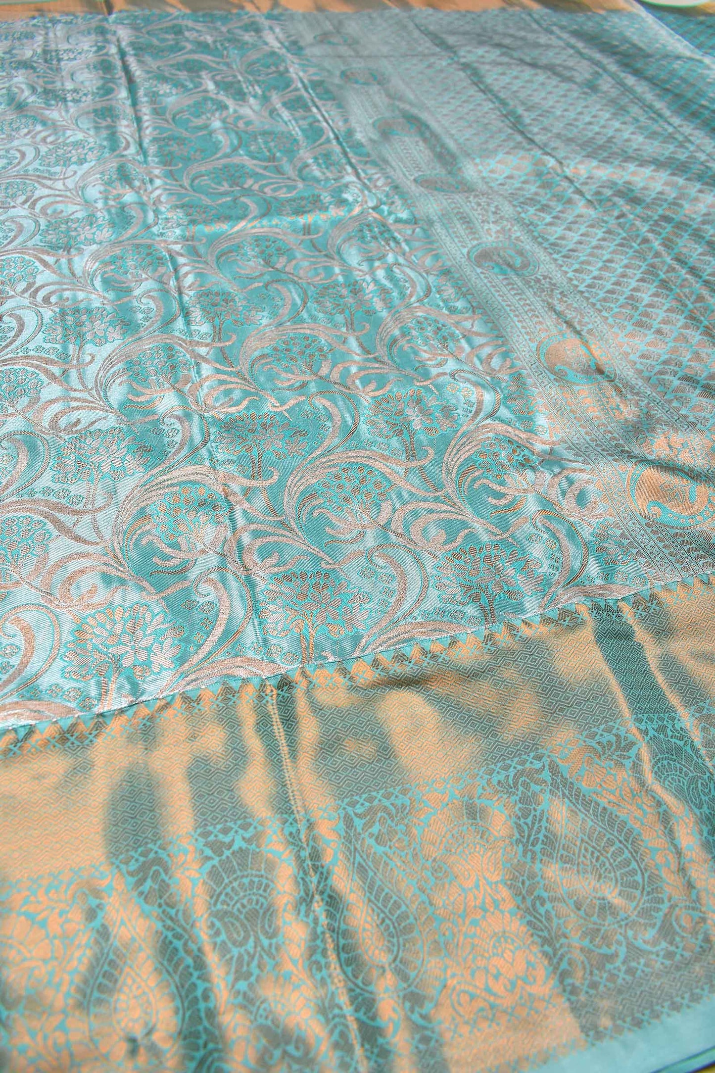 Turquoise Blue Semi Silk Tissue Floral Waves Brocade Saree