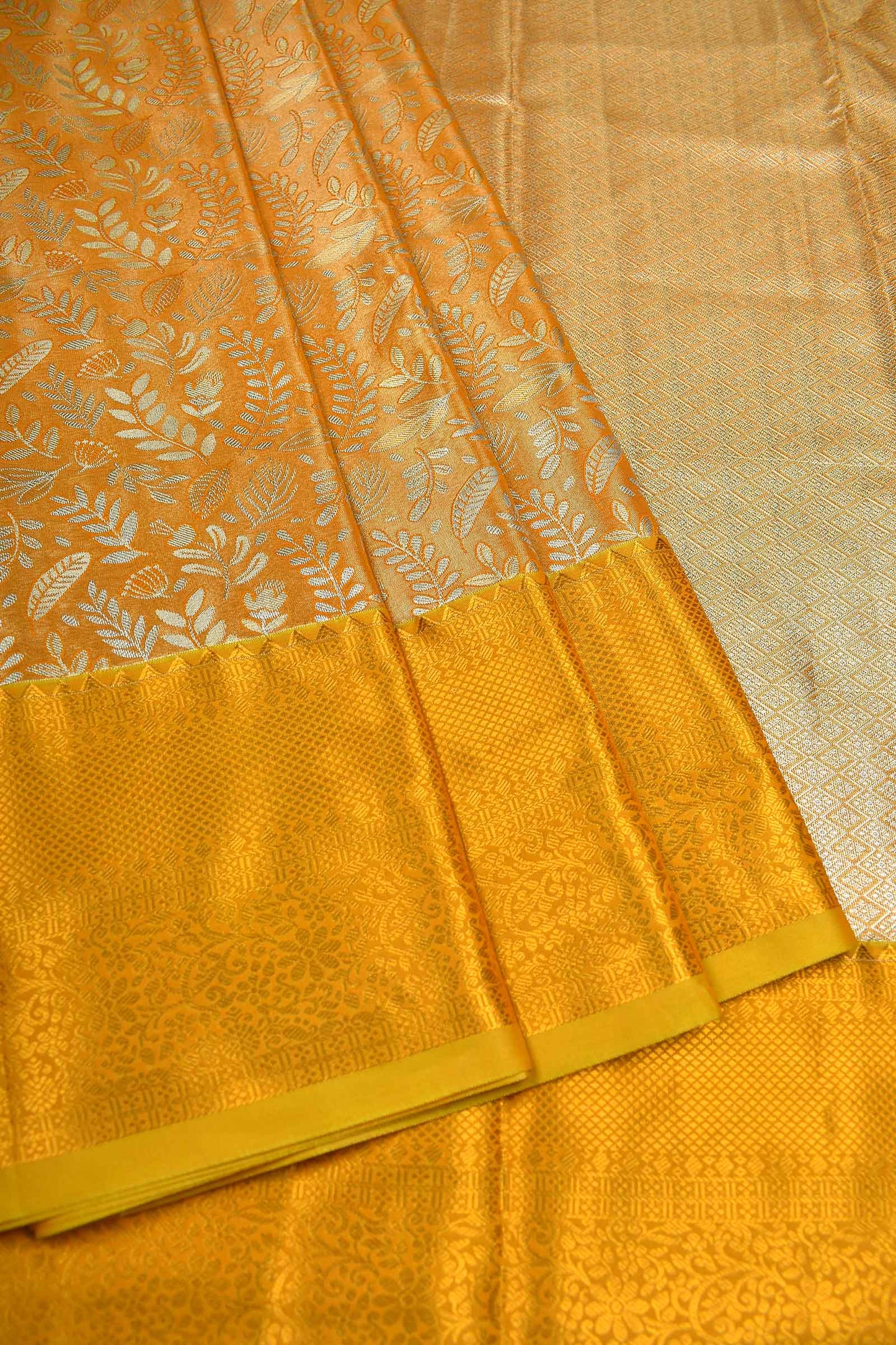 Golden Yellow Semi Silk Tissue Leaves Brocade Gold Border Saree