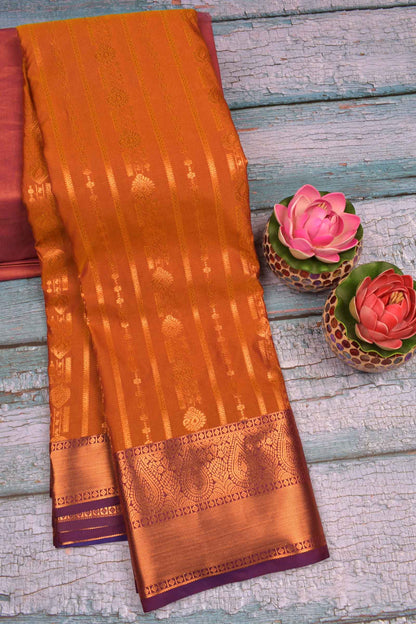 Deep Yellow Semi Soft Silk Jari Traditional Lines Contrast Violet Border Saree