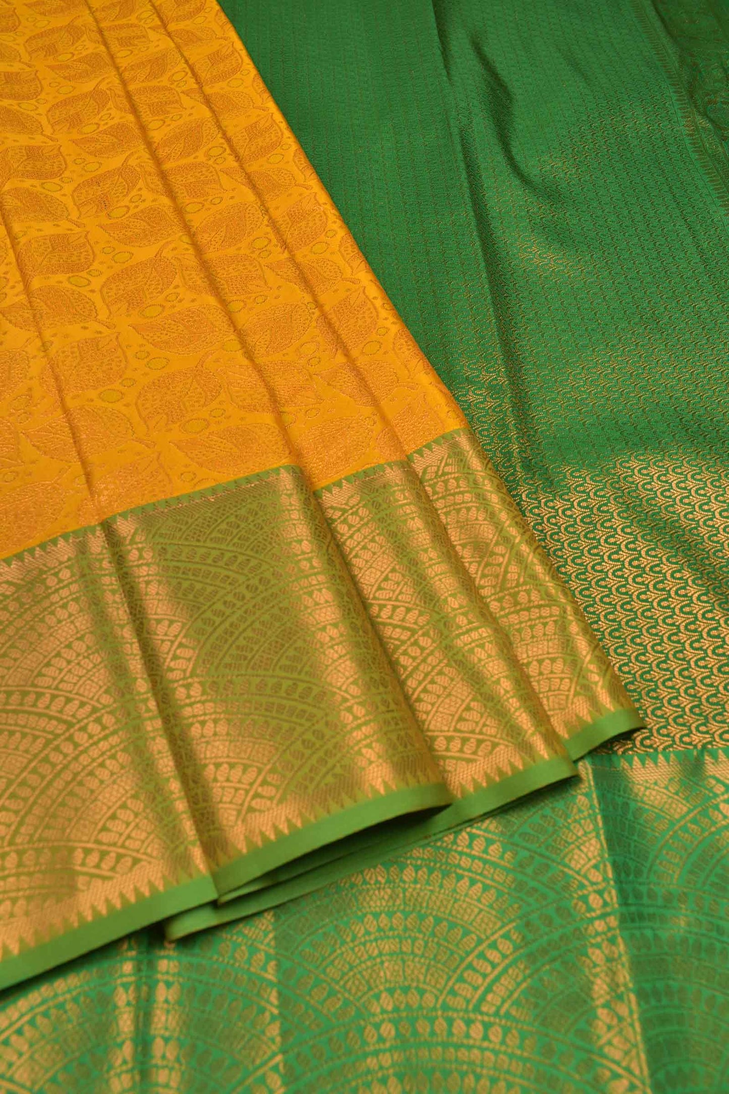 Golden Yellow Semi Silk All Over Leaves Design Fancy Green Border Saree