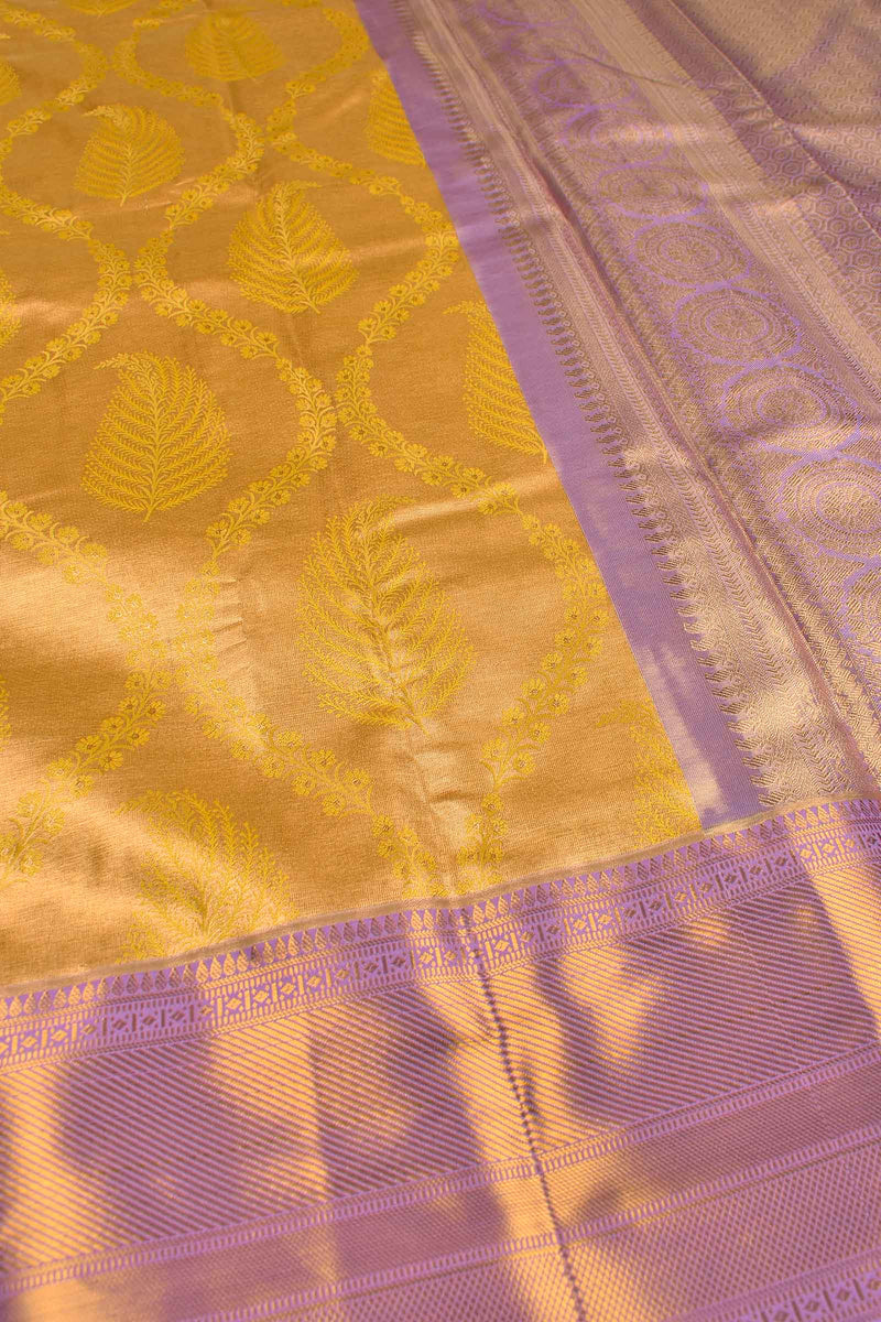 Mustard Yellow Semi Silk Tissue Floral Ferns Design Violet Zari Border Saree