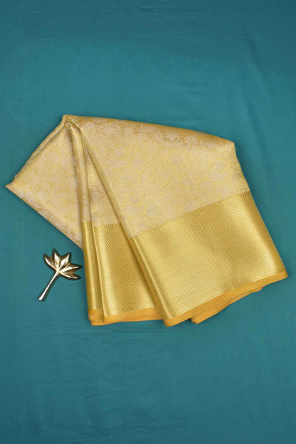 Yellow Tissue With Fancy Ivory Florals Zari Border Saree