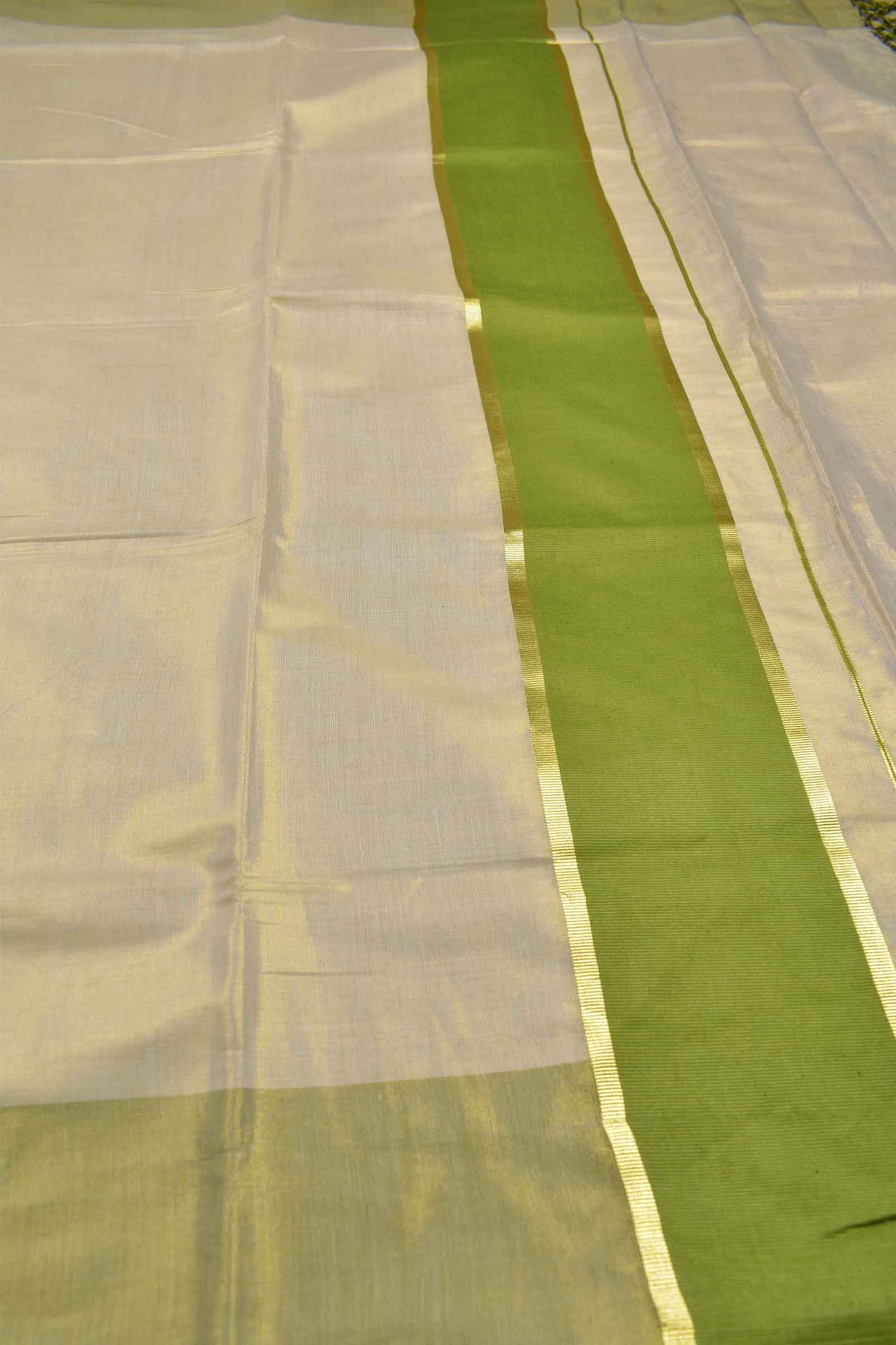 Off White With Green Kerala Tissue Cotton Golden Zari Line Saree