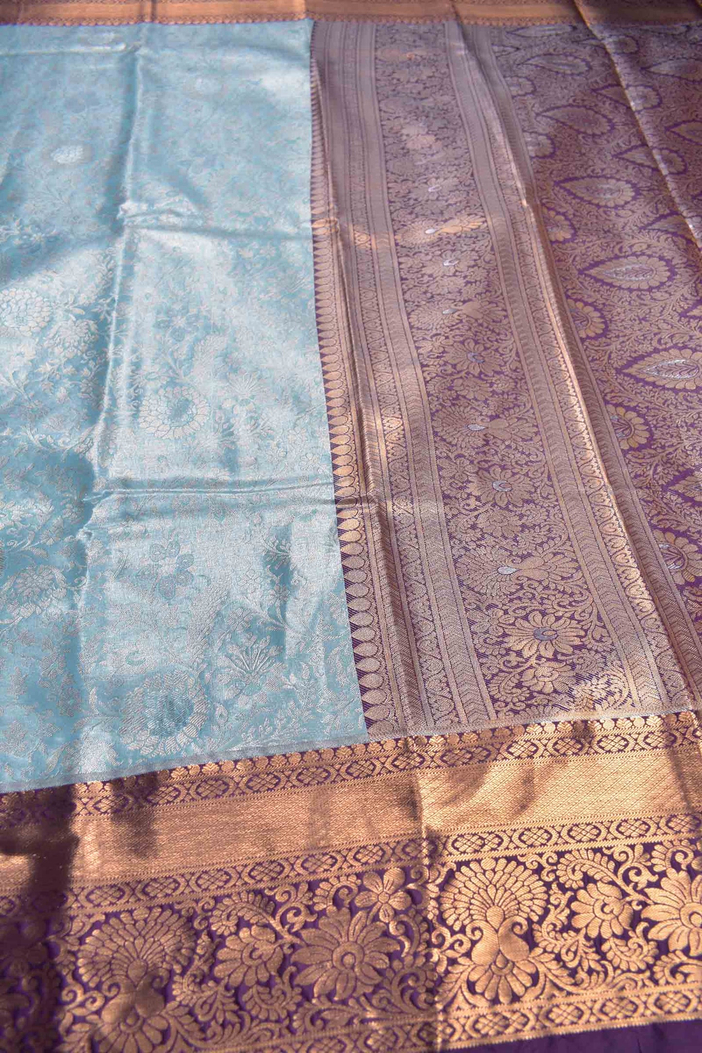Light Blue Semi Silk Rich Floral Body Contrast Zari Border Pallu Saree