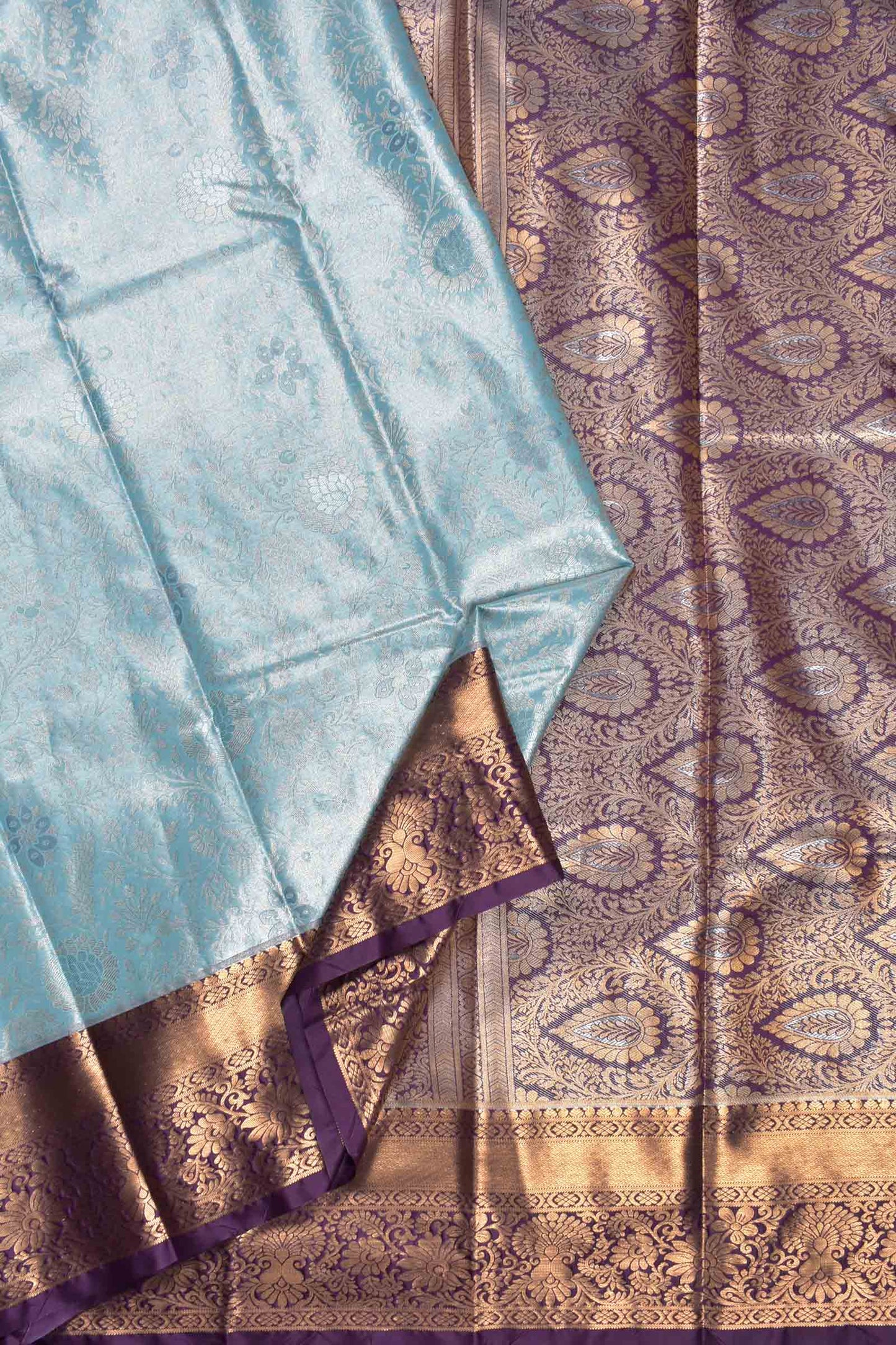 Light Blue Semi Silk Rich Floral Body Contrast Zari Border Pallu Saree