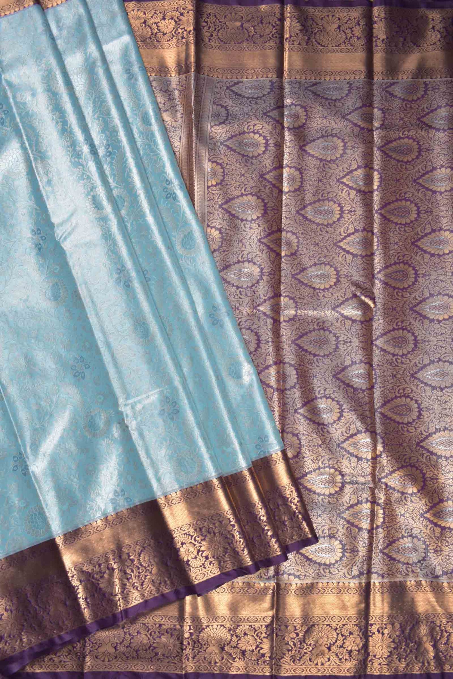 Light Blue Semi Silk Rich Floral Body Contrast Zari Border Pallu Saree