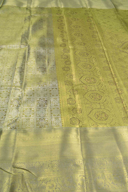 Golden Allow Green Semi Silk Tissue Floral Checks Kolam Print Green Zari Pallu Saree