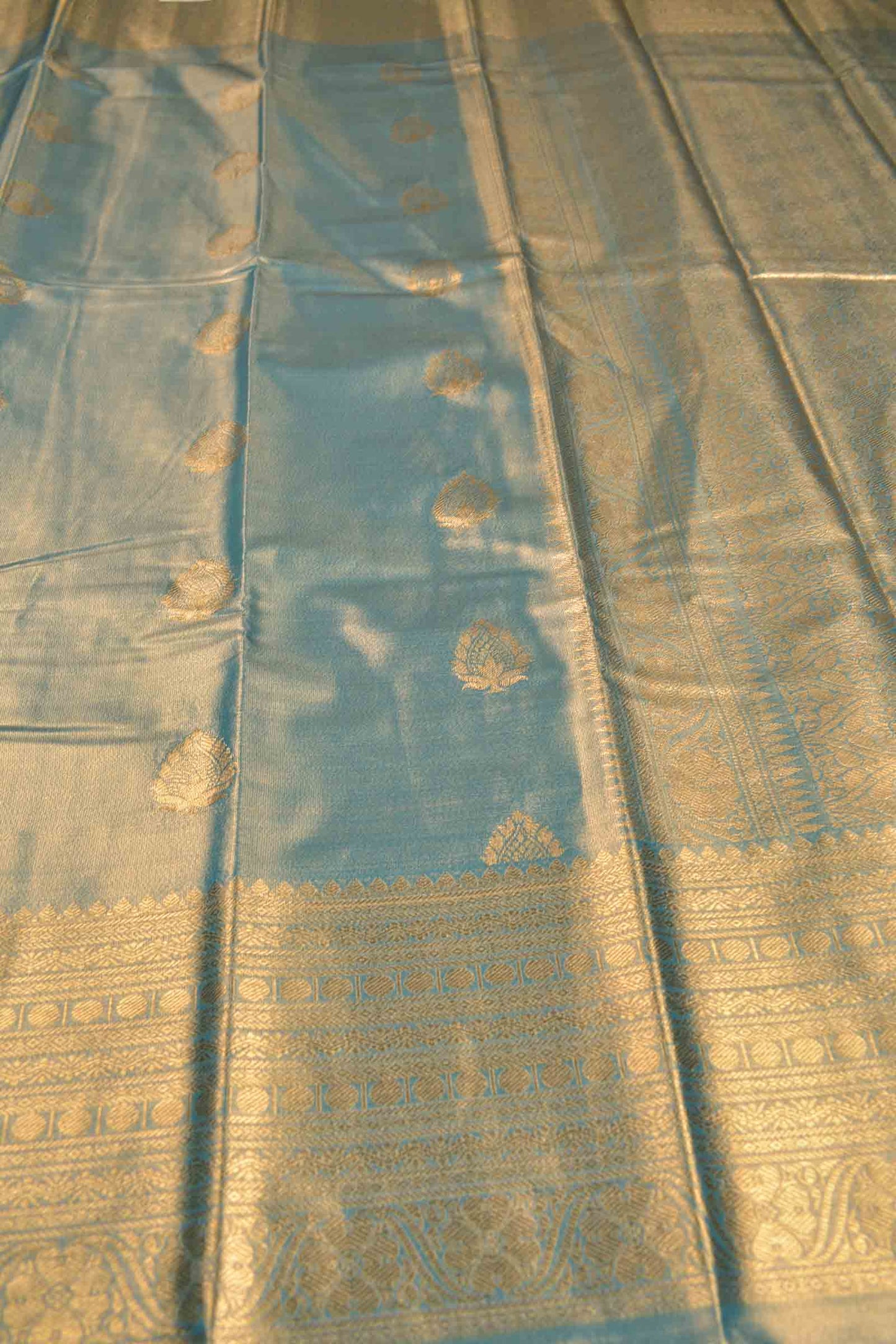 Golden Light Grey Blue Shade Semi Tissue Silk Fancy Butta Zari Border Pallu Saree