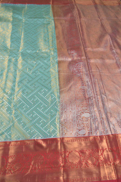 Golden Light Blue Semi Silk Geometric Rangoli Contrast Red Zari Border Saree