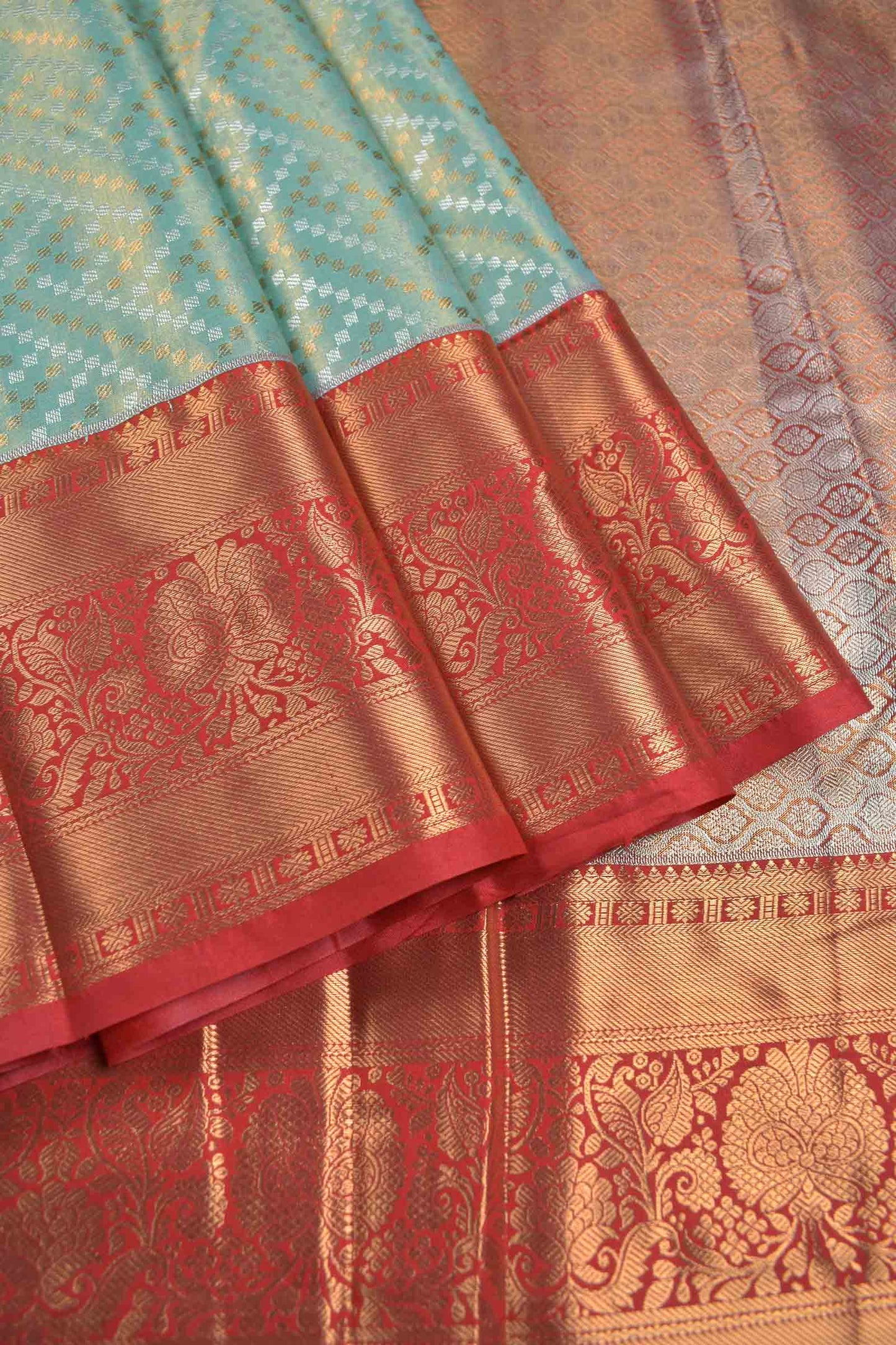 Golden Light Blue Semi Silk Geometric Rangoli Contrast Red Zari Border Saree