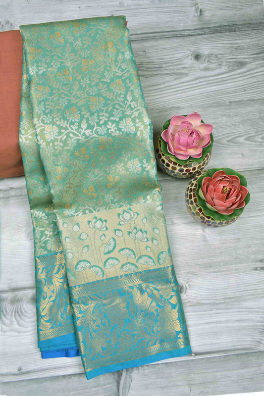 Golden Light Green Semi Silk All Over Florals Golden Blue Border Saree