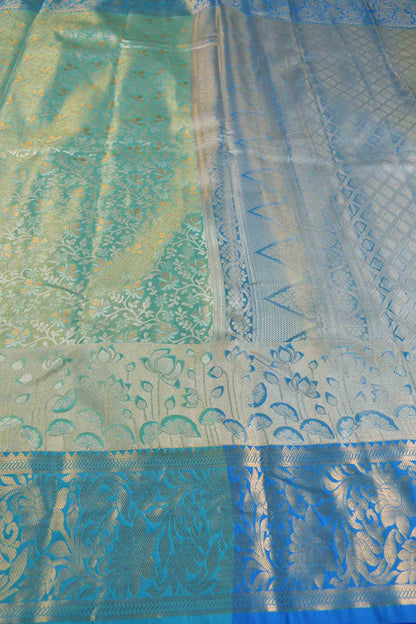 Golden Light Green Semi Silk All Over Florals Golden Blue Border Saree