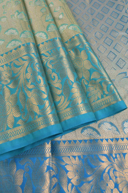 Golden Light Green Semi Silk All Over Florals Golden Blue Border Saree