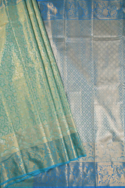 Golden Light Green Semi Silk All Over Florals Golden Blue Border Saree
