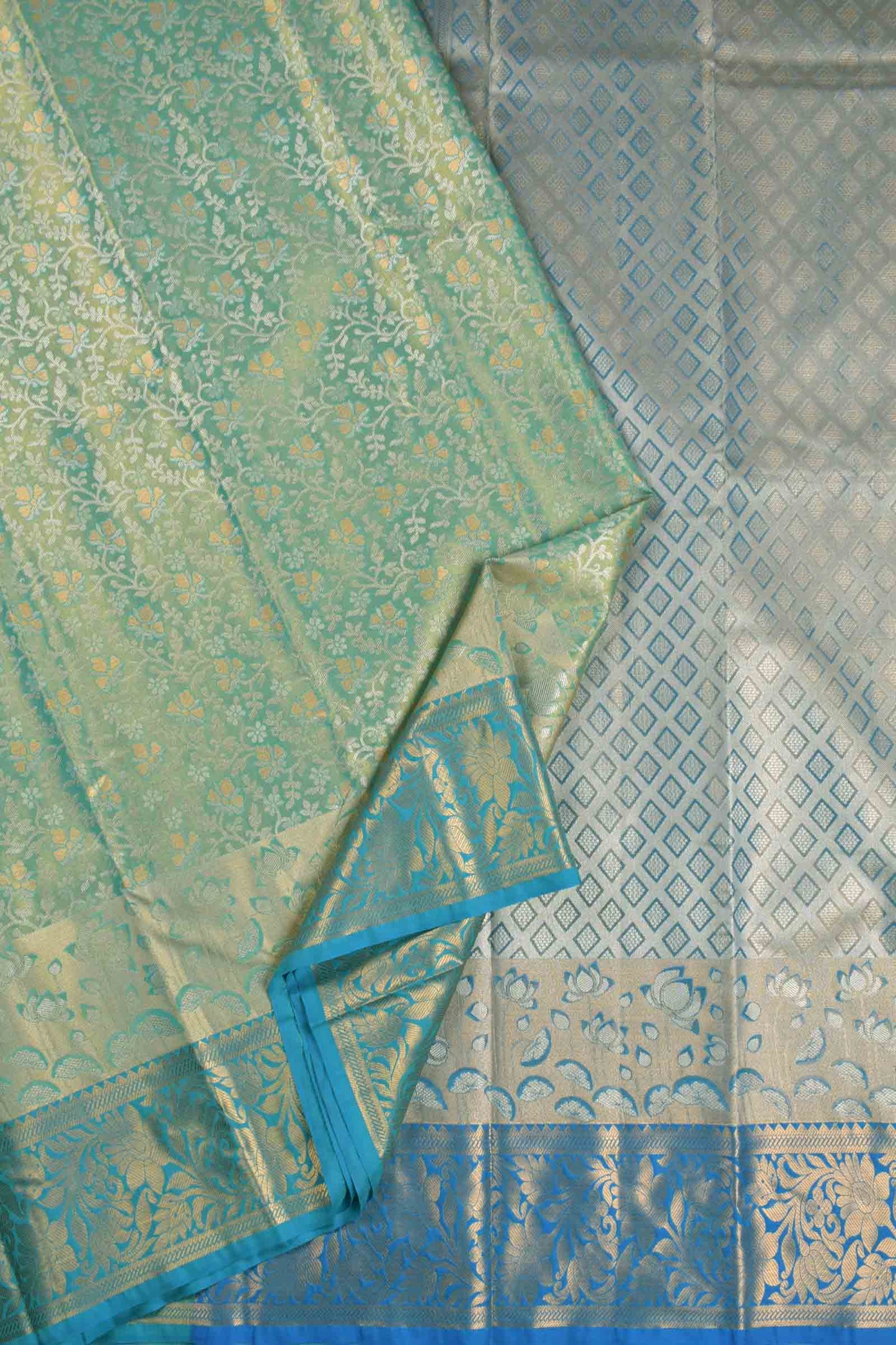 Golden Light Green Semi Silk All Over Florals Golden Blue Border Saree