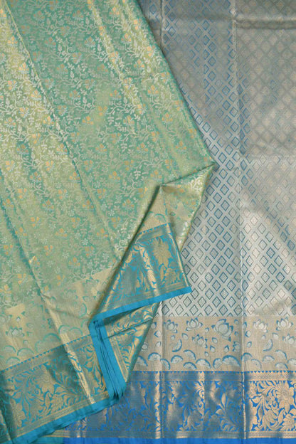 Golden Light Green Semi Silk All Over Florals Golden Blue Border Saree