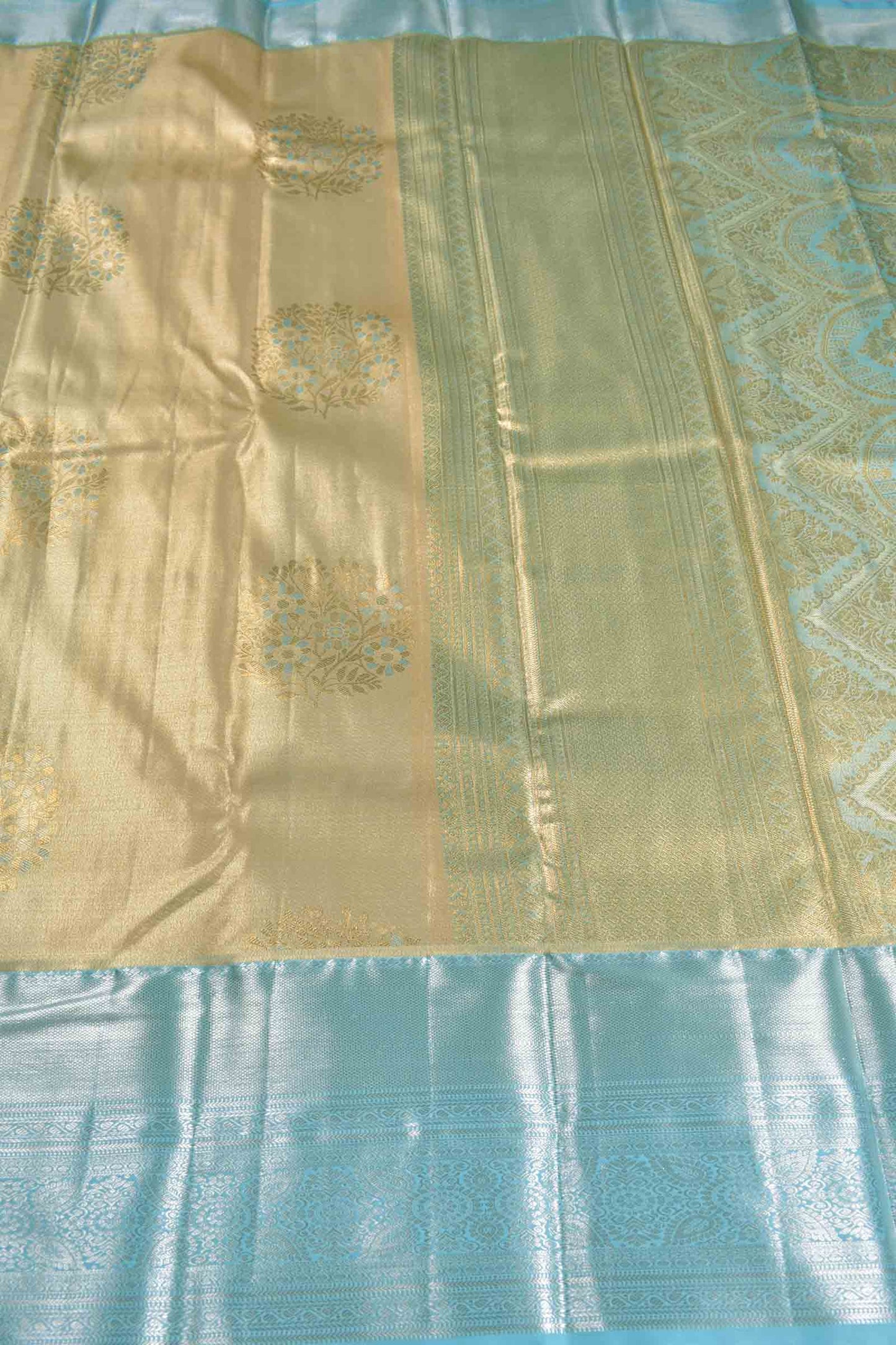 Golden Sandal Semi Silk Floral Wreath Butta Sky Blue Zari Border Pallu Saree