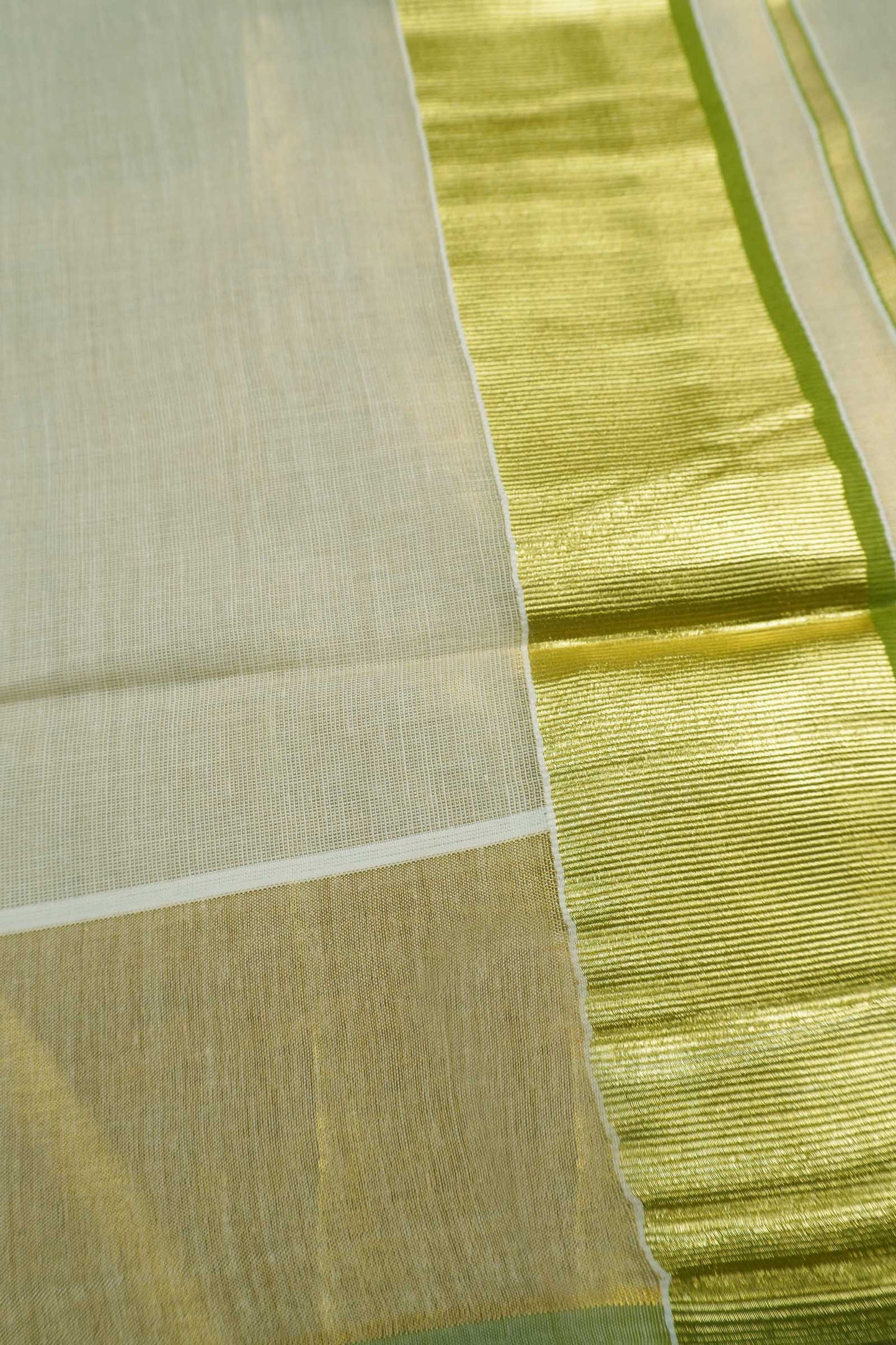Off White Kerala Tissue Cotton Golden Zari Pallu Green Border Saree