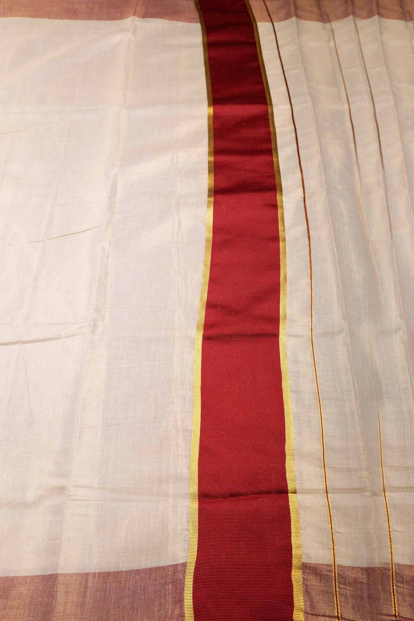 Off White With Maroon Kerala Tissue Cotton Golden Zari Line Saree