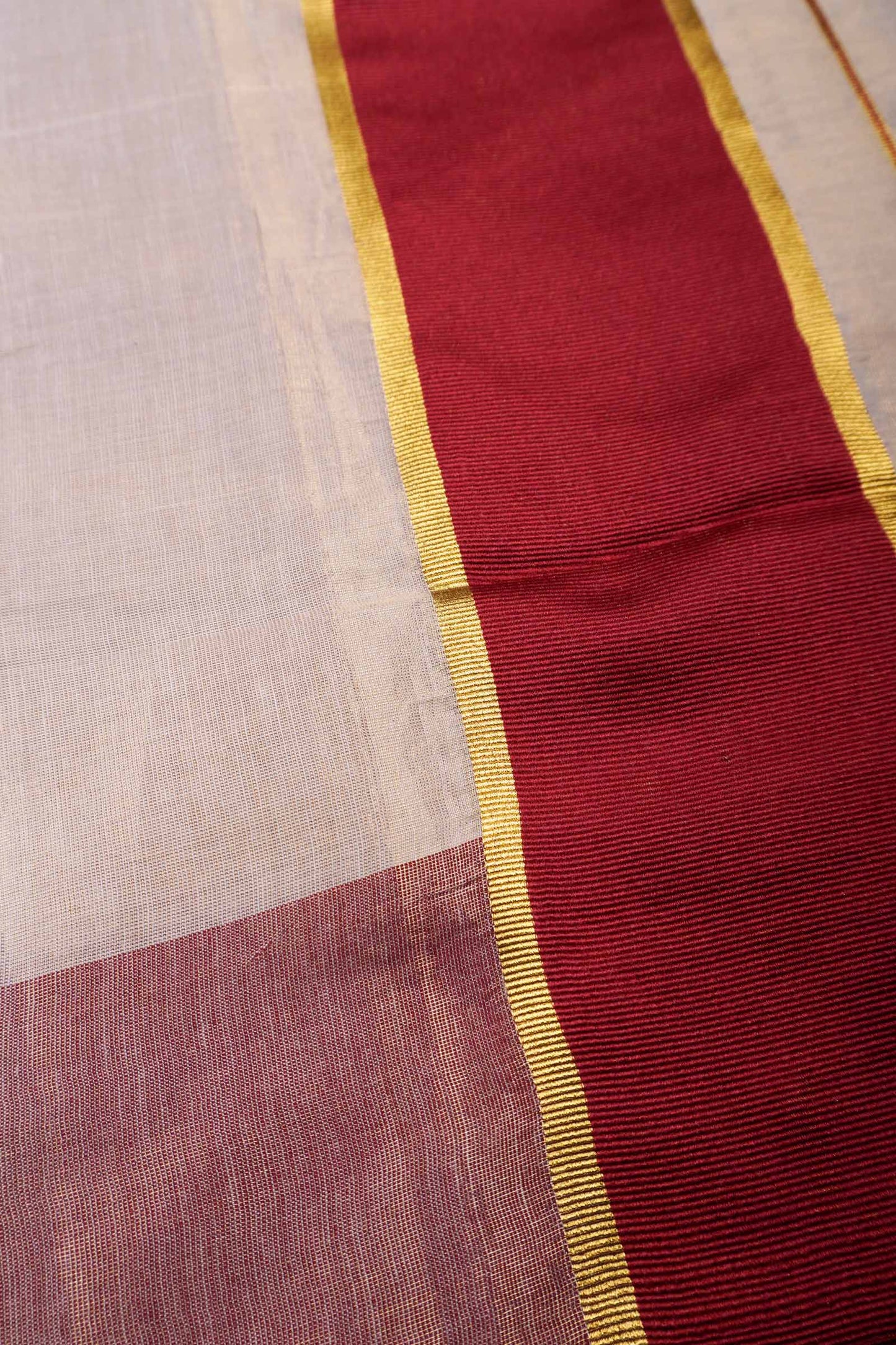 Off White With Maroon Kerala Tissue Cotton Golden Zari Line Saree