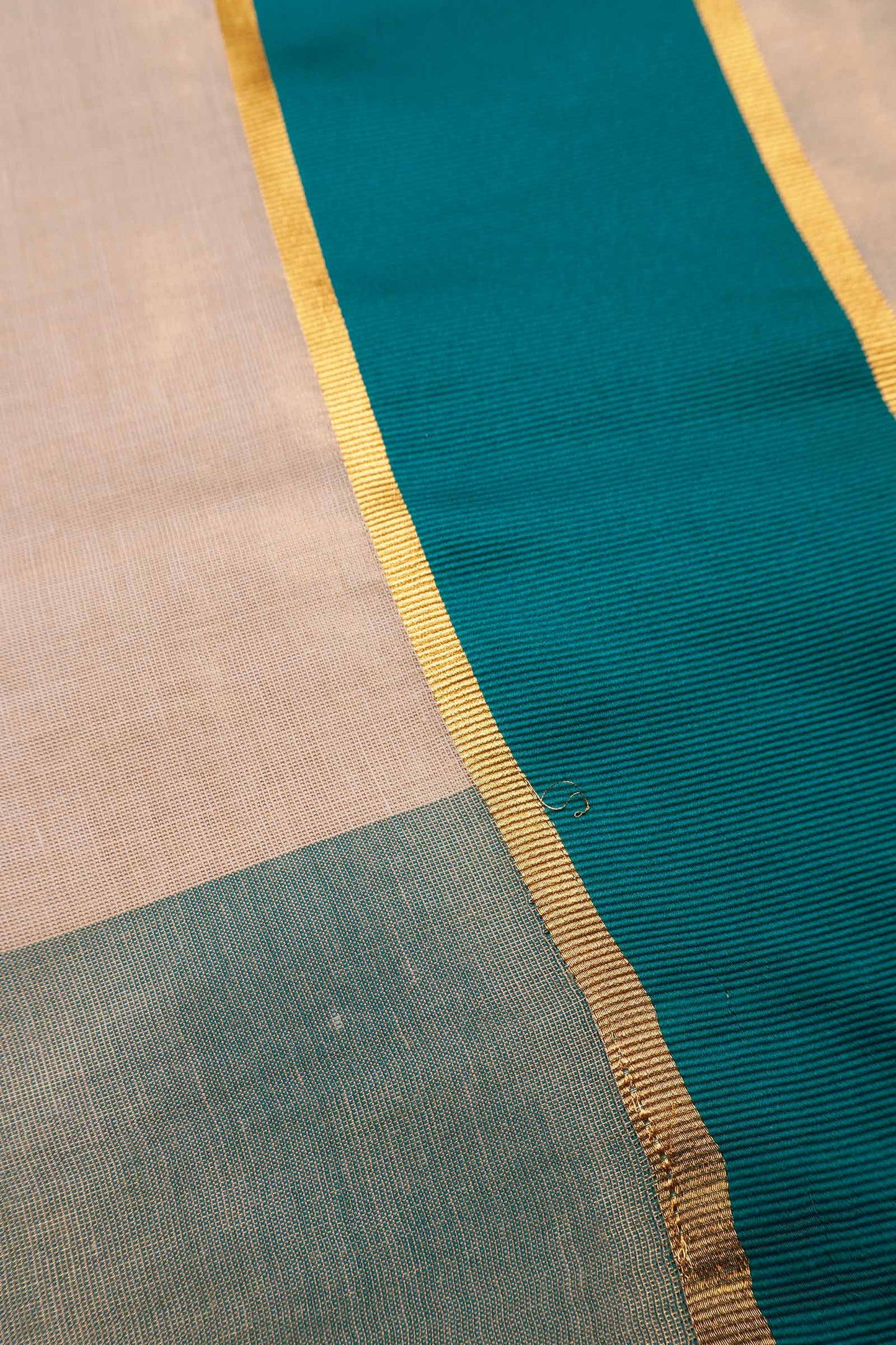 Off White With Peacock Blue Kerala Tissue Cotton Golden Zari Line Saree