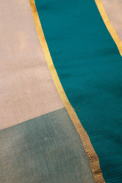 Off White With Peacock Blue Kerala Tissue Cotton Golden Zari Line Saree