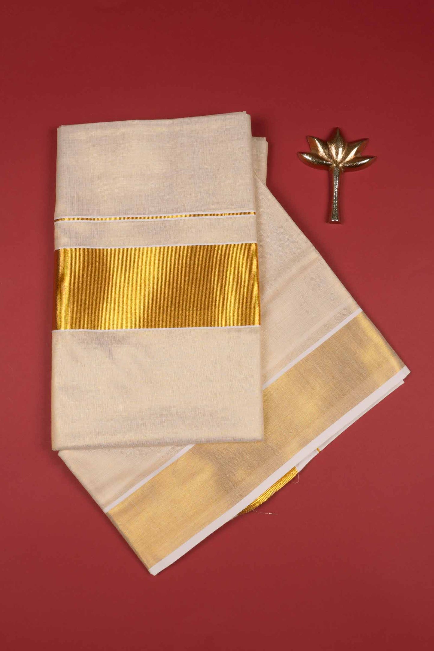Off White Kerala Tissue Minimalistic Plain Body Golden Zari Border Saree