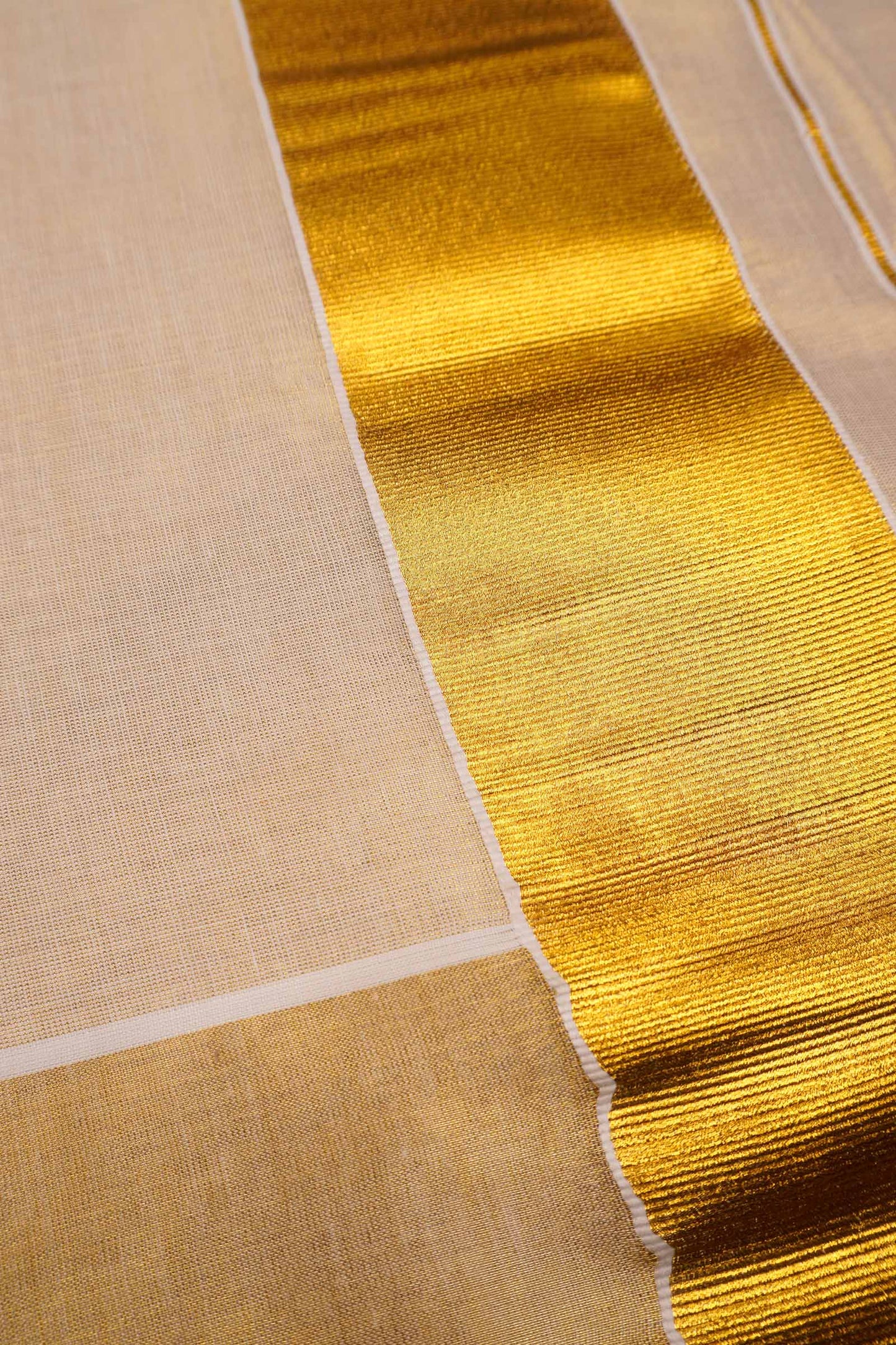Off White Kerala Tissue Minimalistic Plain Body Golden Zari Border Saree