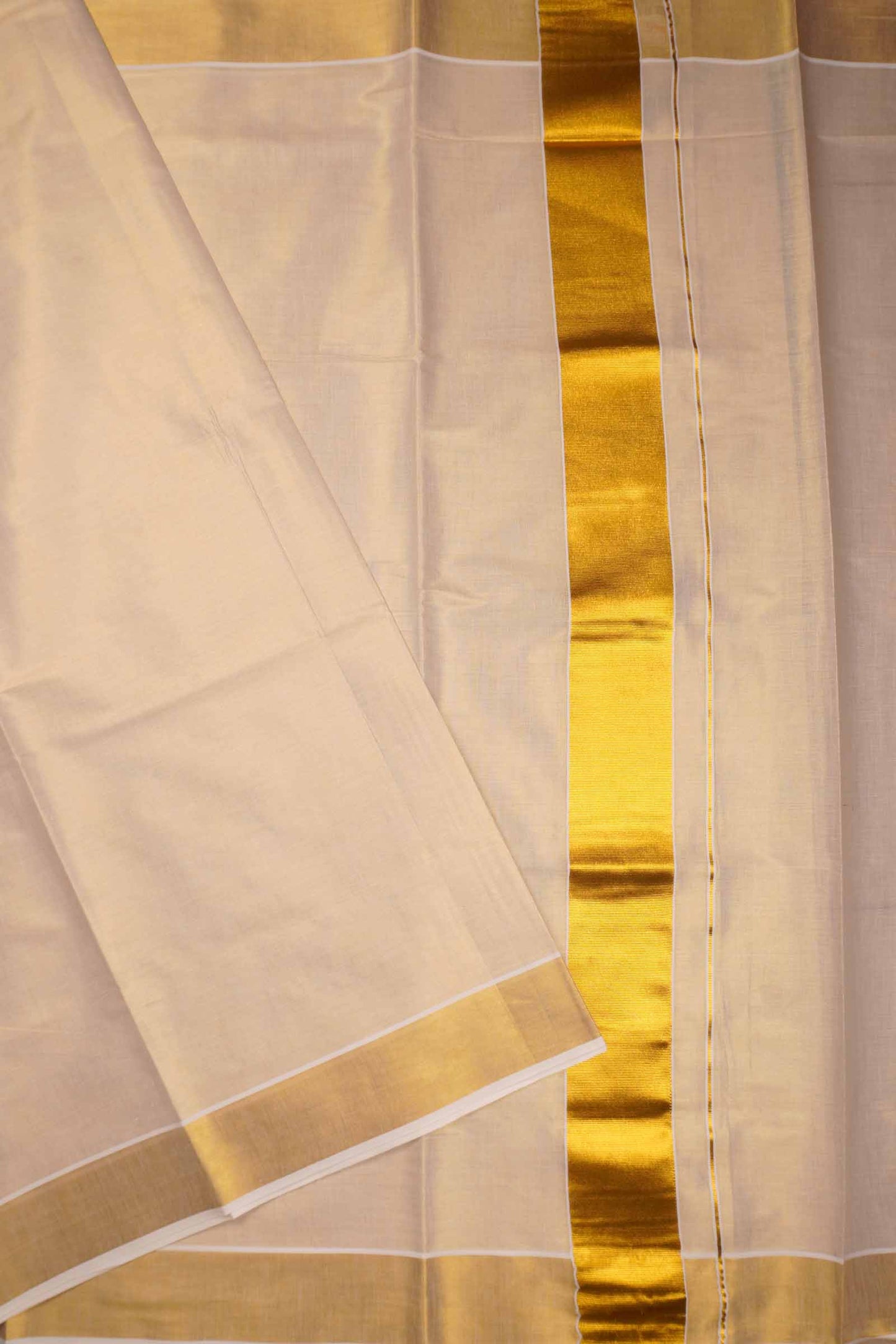Off White Kerala Tissue Minimalistic Plain Body Golden Zari Border Saree
