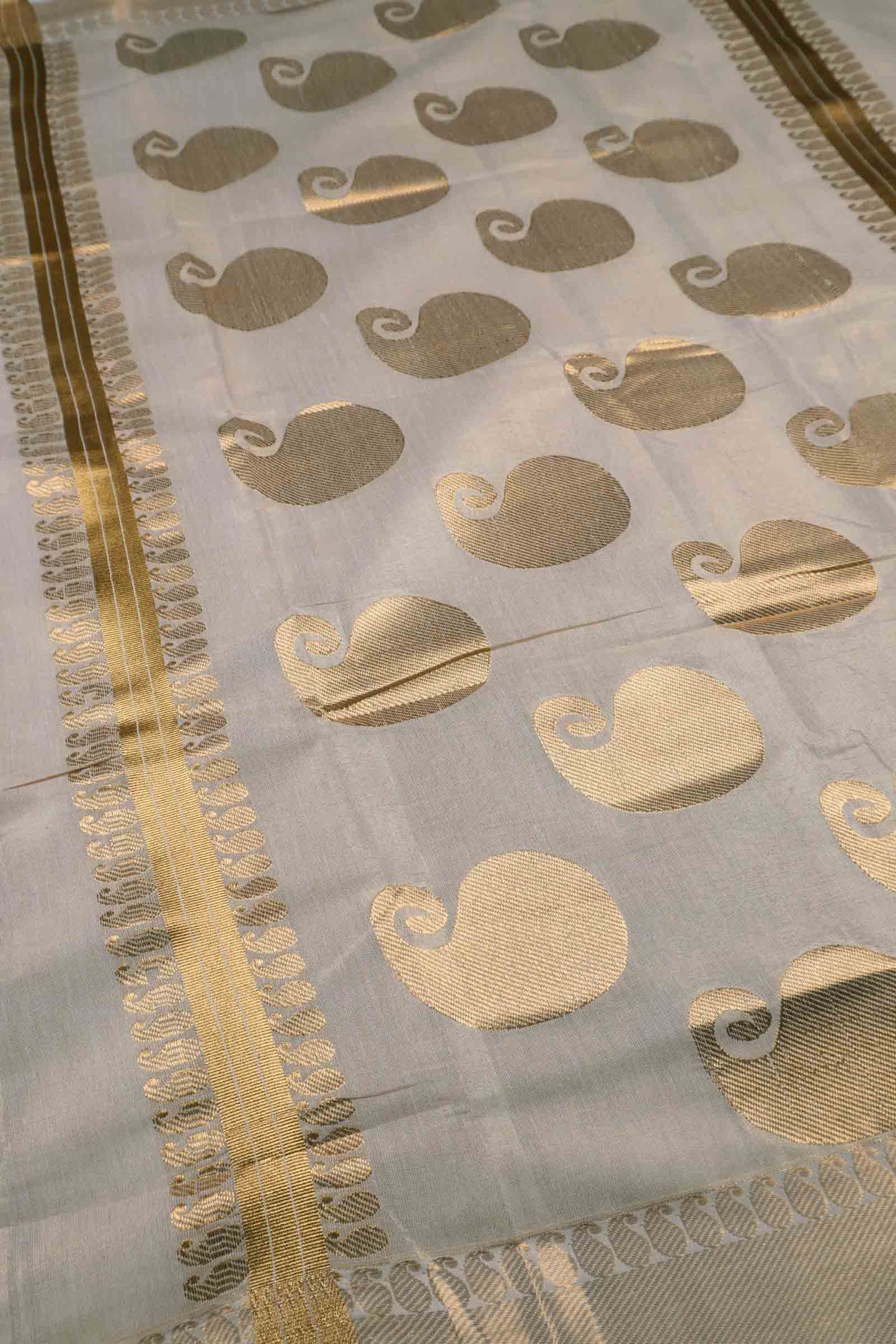 Off White Kerala Tissue Cotton Mango Butta Golden Zari Line Saree