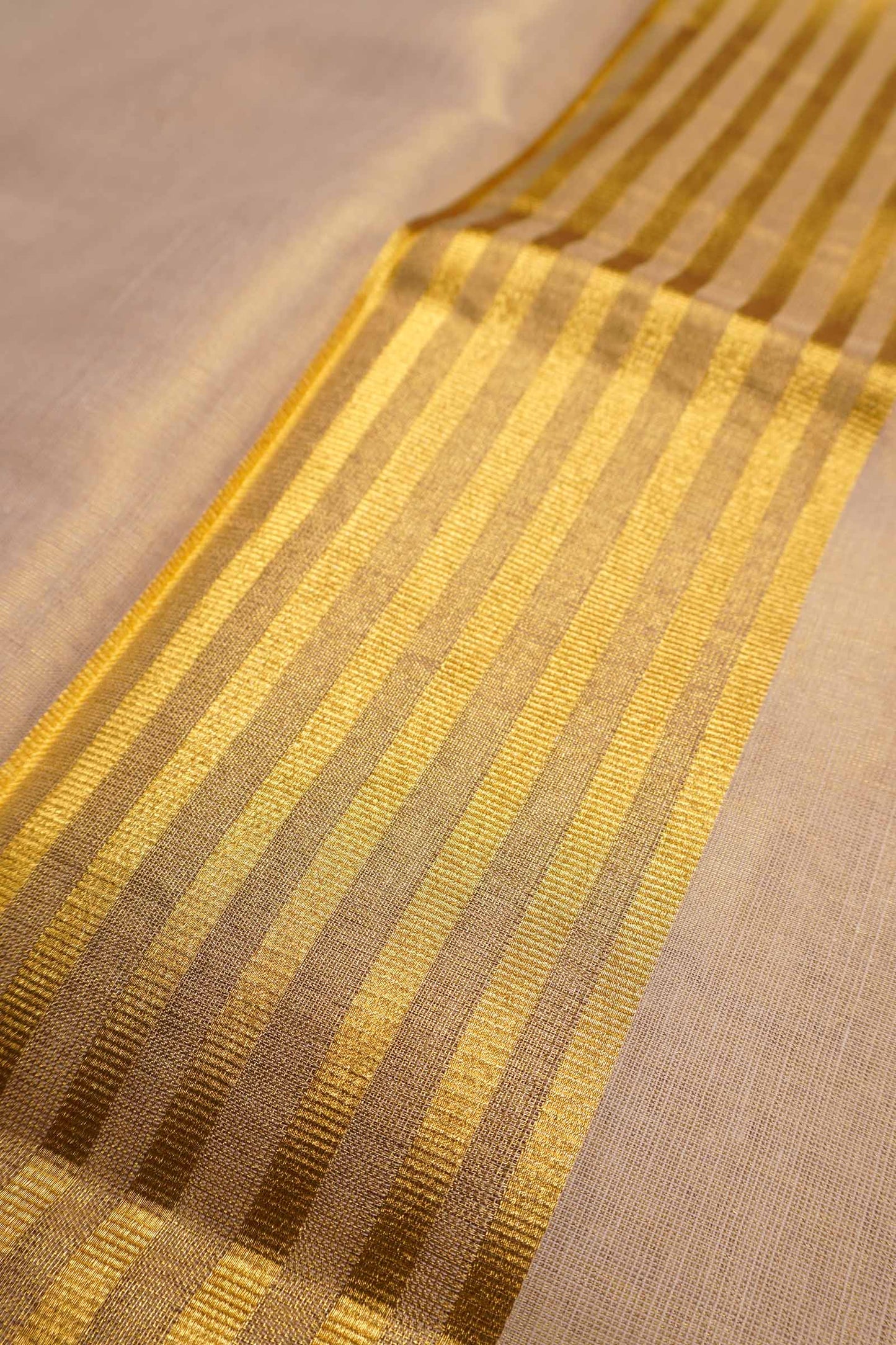 Off White Kerala Tissue Cotton Golden Temple Border Saree