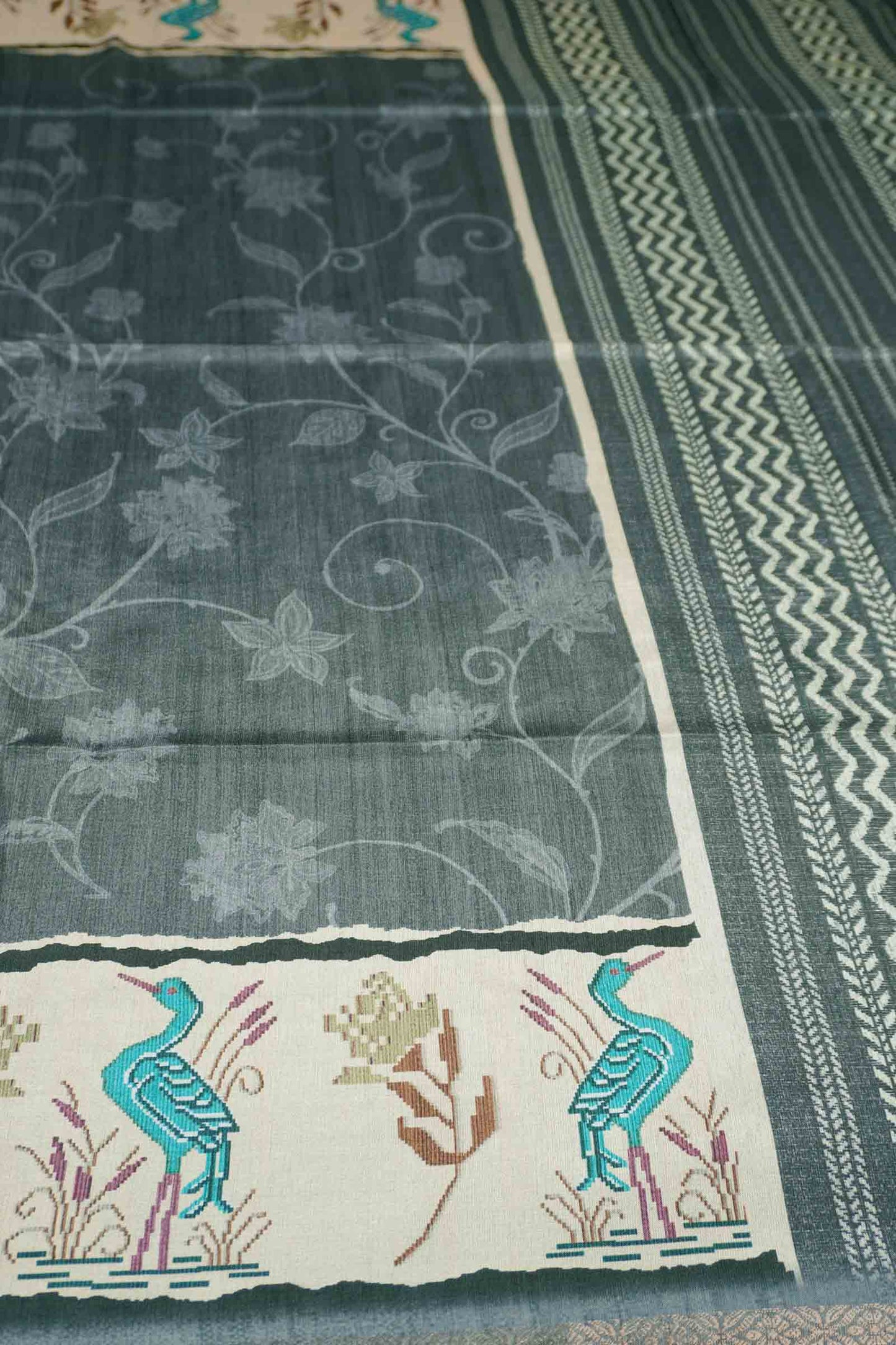 Ash Black Semi Tussar Blooming Magic Prints Crane Border Saree