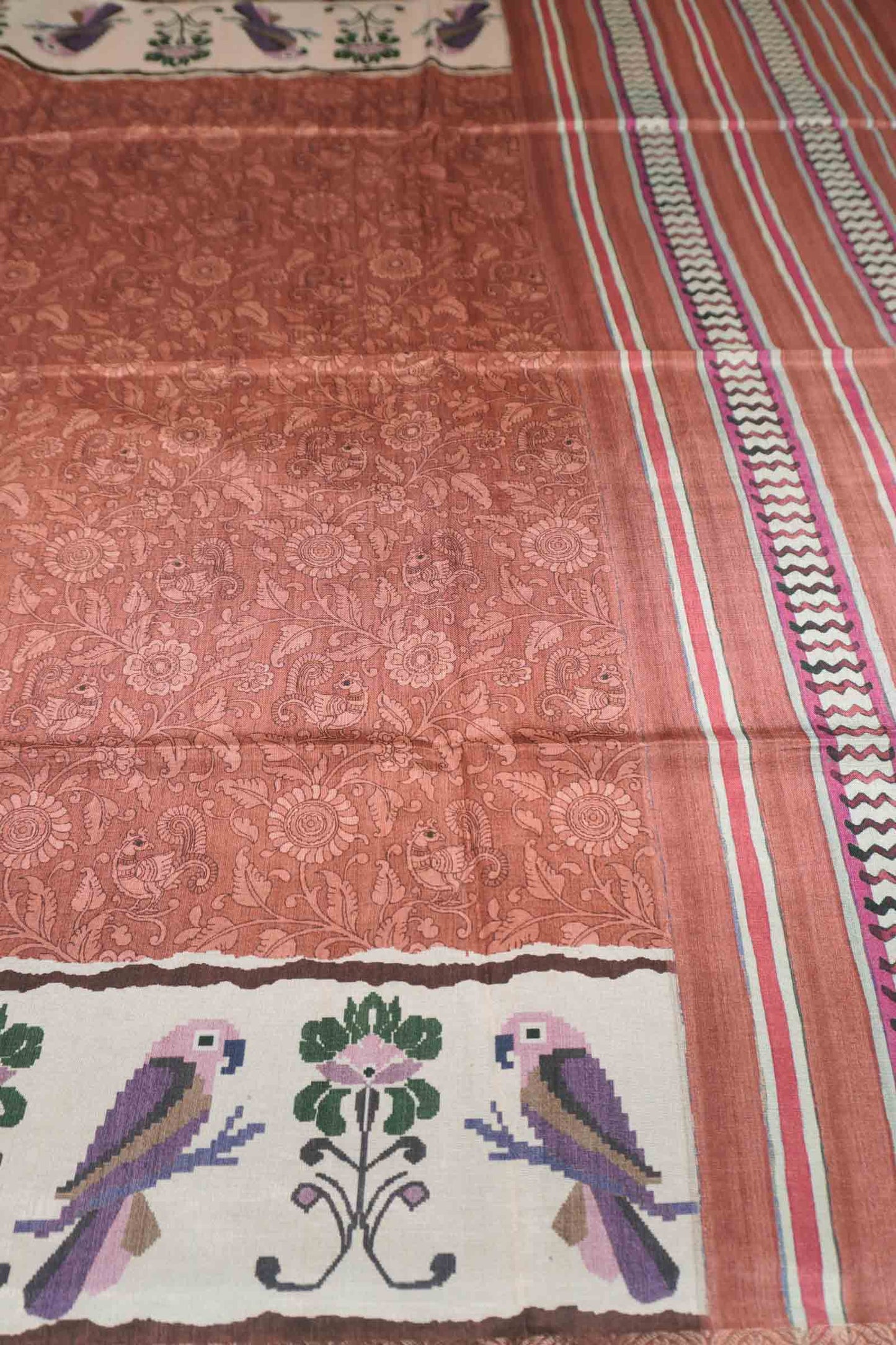 Orange Semi Tussar Blooming Magic Prints Parrot Border Saree