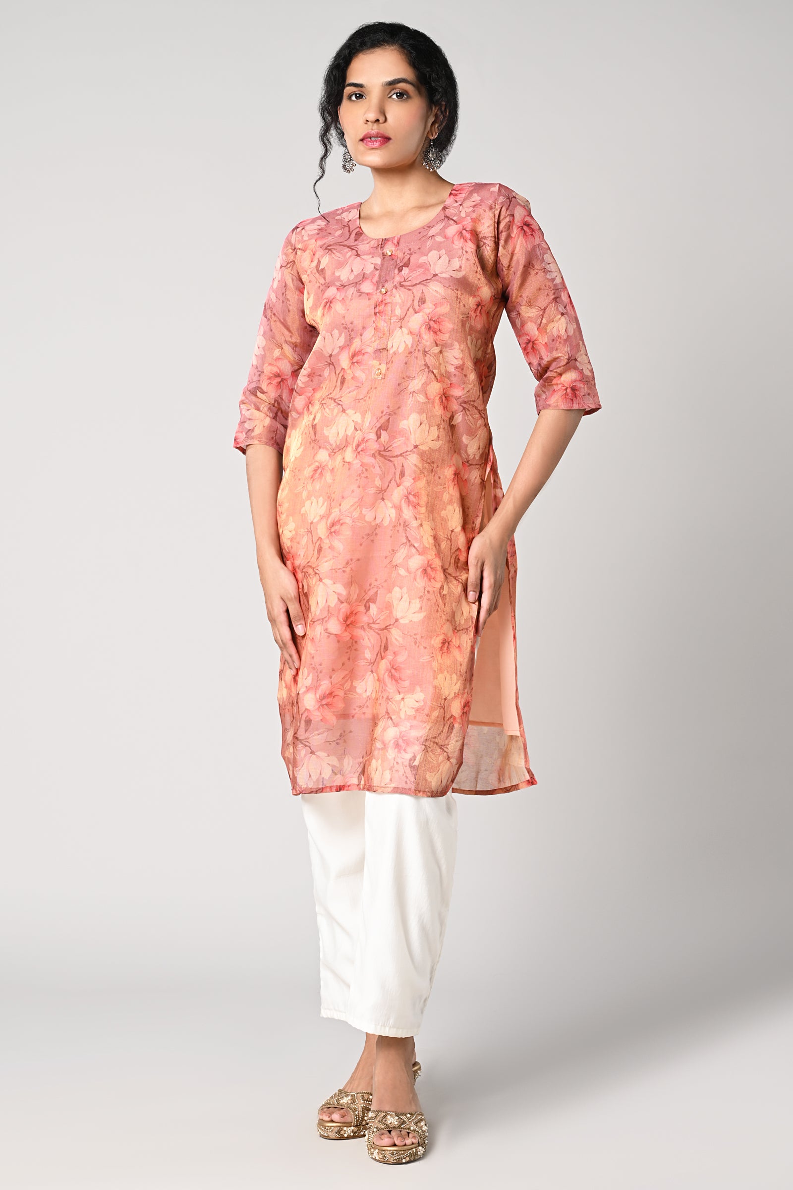 straight top,
floral prints all over the body,
round neck &amp; 3/4 sleeves,
shimmer material.