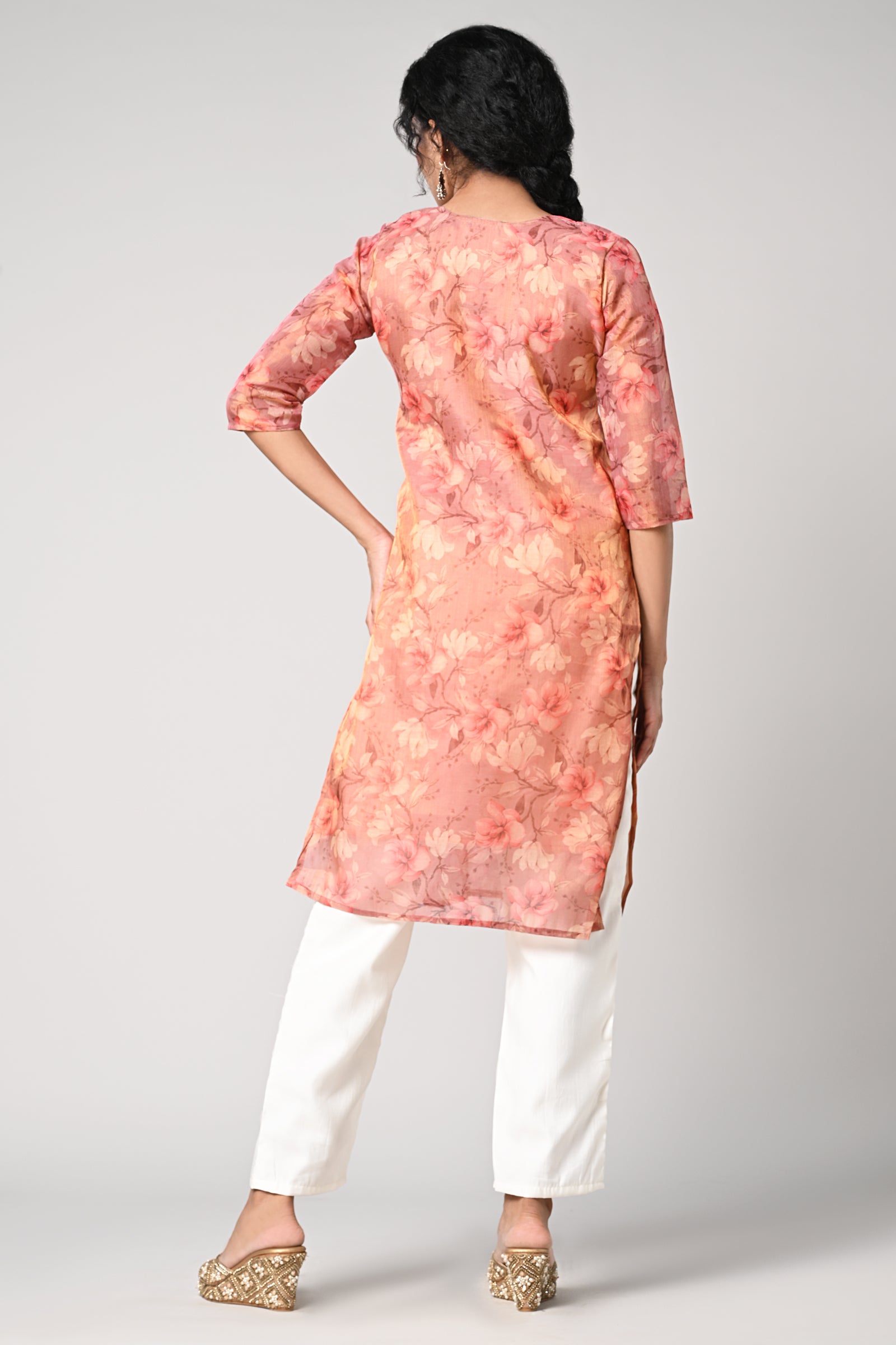 straight top,
floral prints all over the body,
round neck &amp; 3/4 sleeves,
shimmer material.