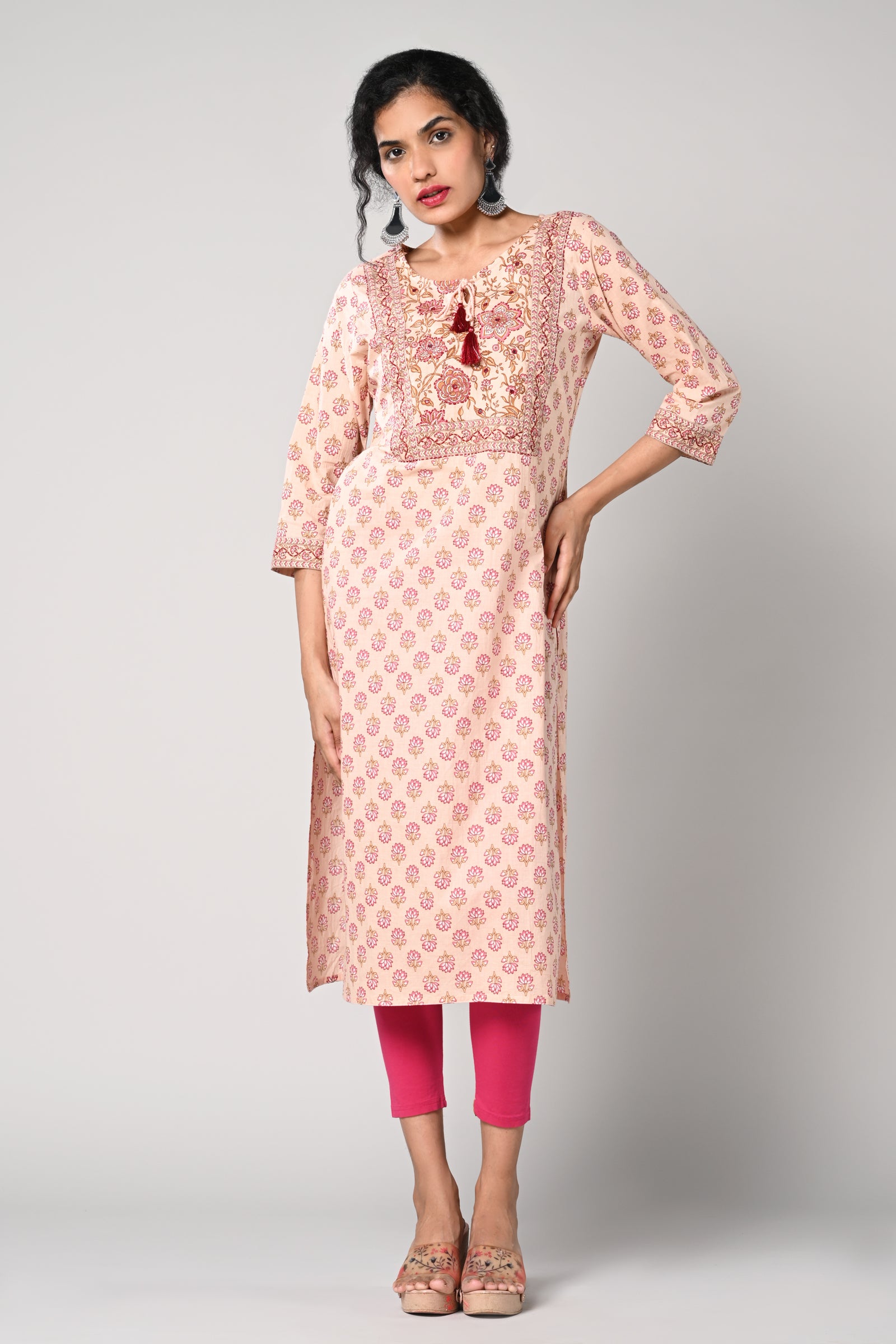 straight kurti,
floral prints all over the body,
round neck &amp; 3/4 sleeves,
pure jaipur cotton material.