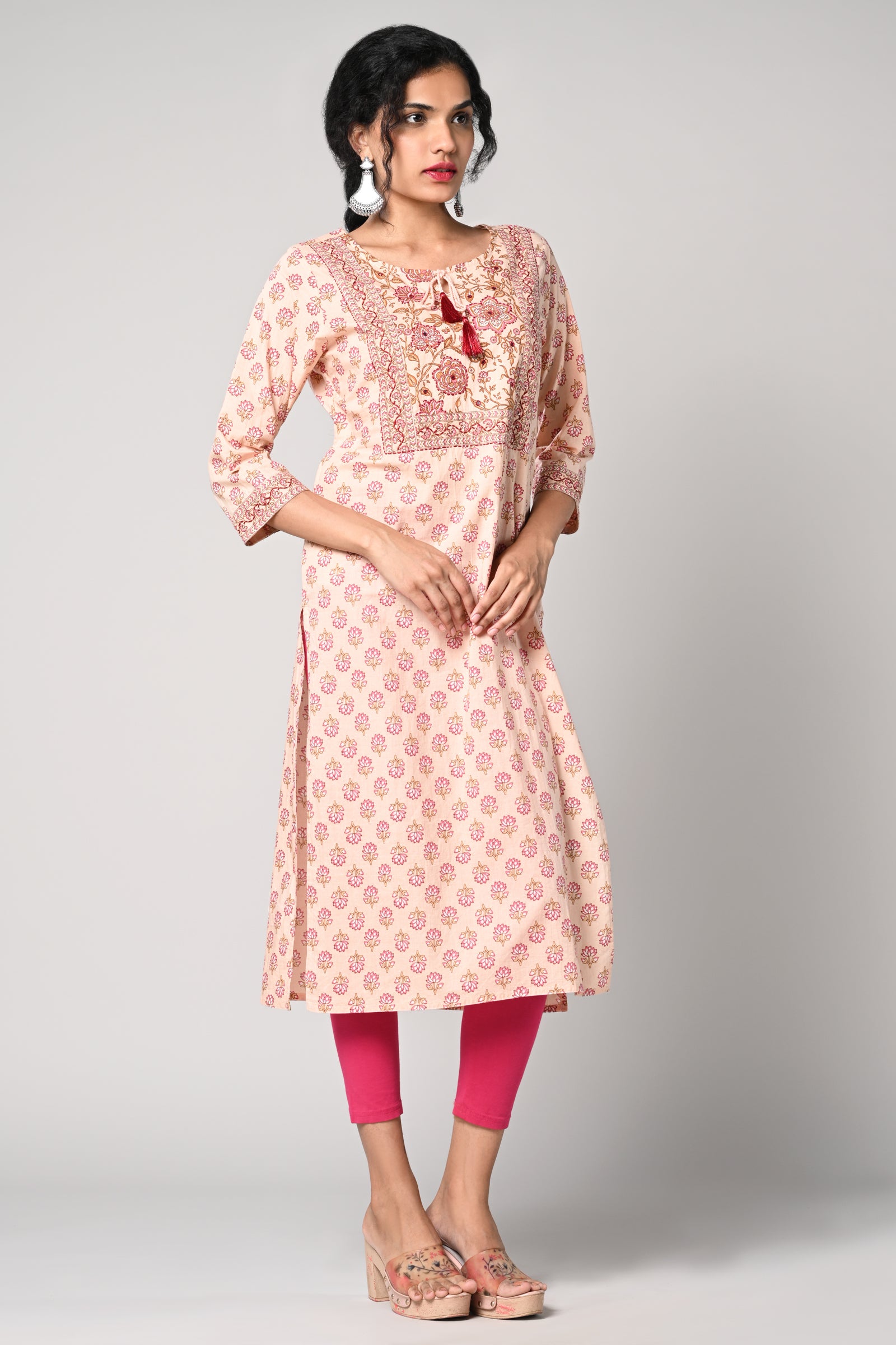 straight kurti,
floral prints all over the body,
round neck &amp; 3/4 sleeves,
pure jaipur cotton material.