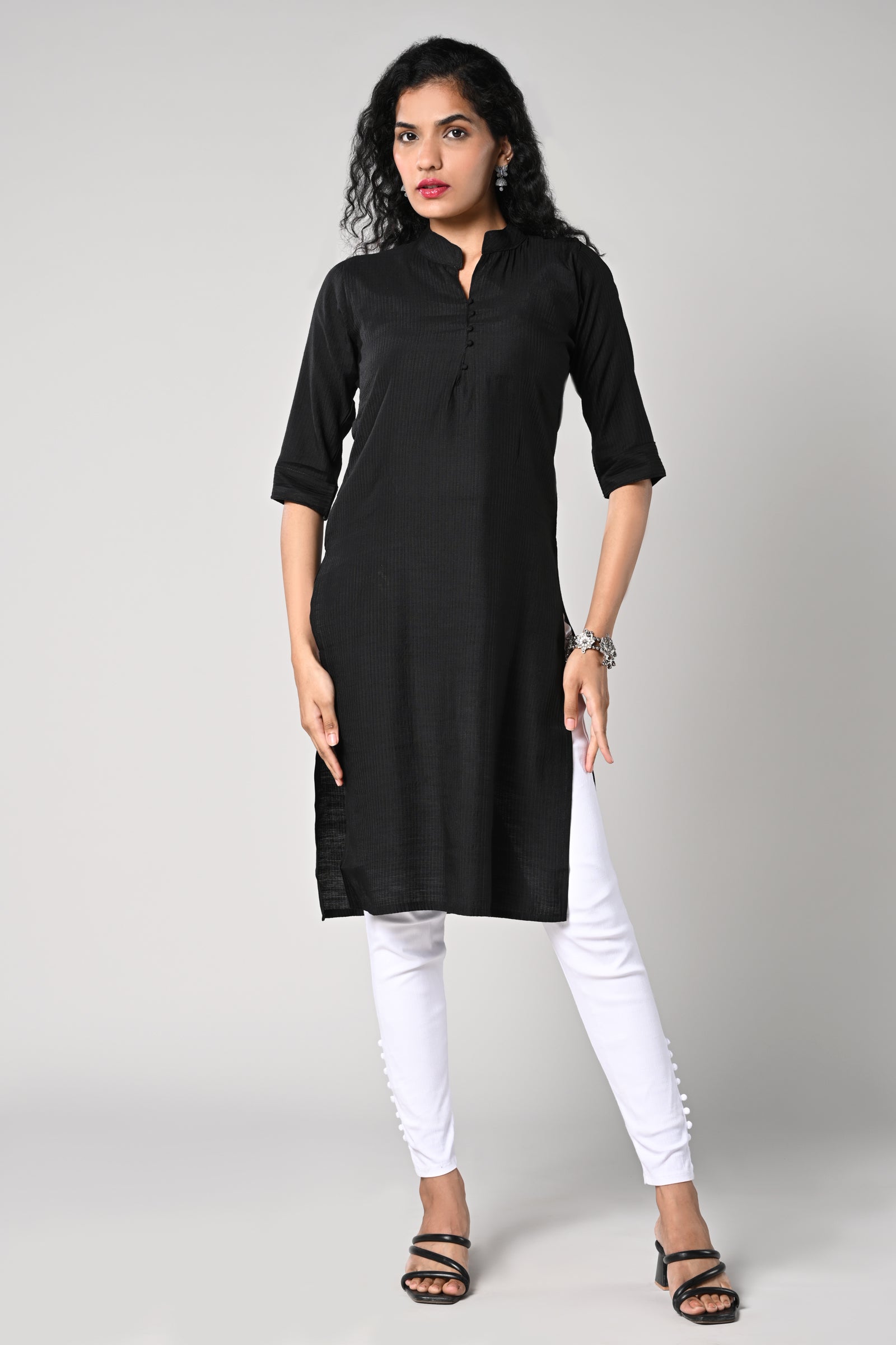 plain straight cut kurti with texture,
close neck &amp; v cut,
comes with 3/4 sleeves.