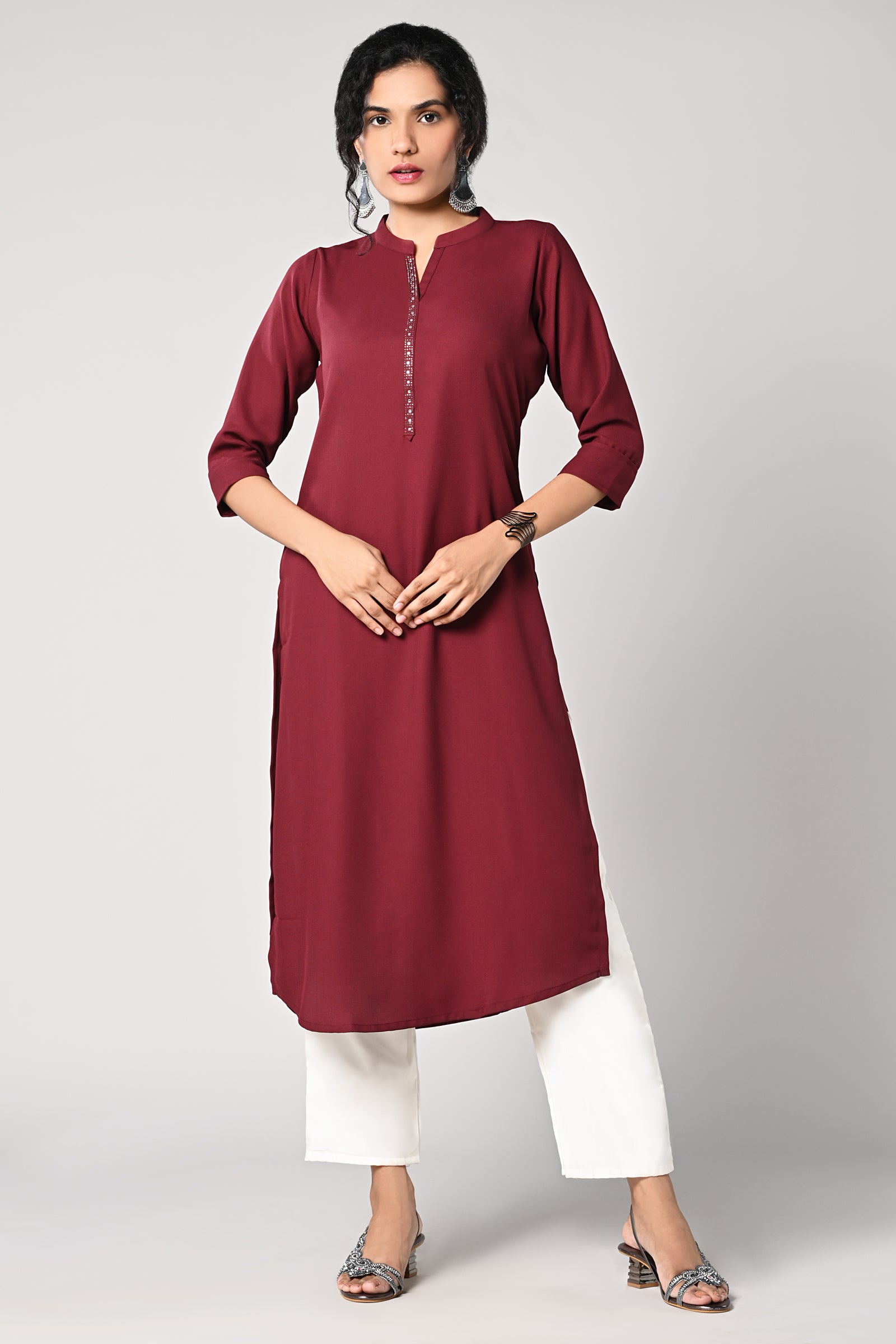 solid plain maroon kurti.
closed neck with v cut.
bead work in neck line.
3/4 attached sleeves.