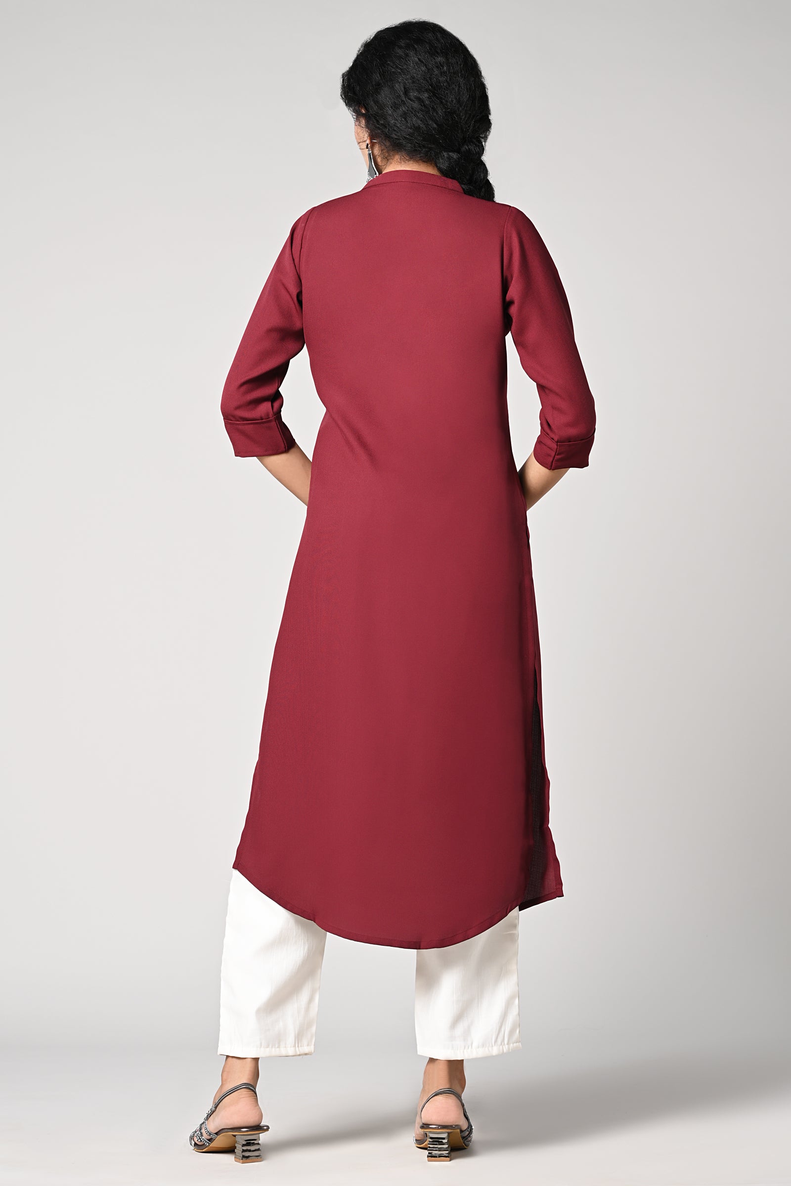 solid plain maroon kurti.
closed neck with v cut.
bead work in neck line.
3/4 attached sleeves.