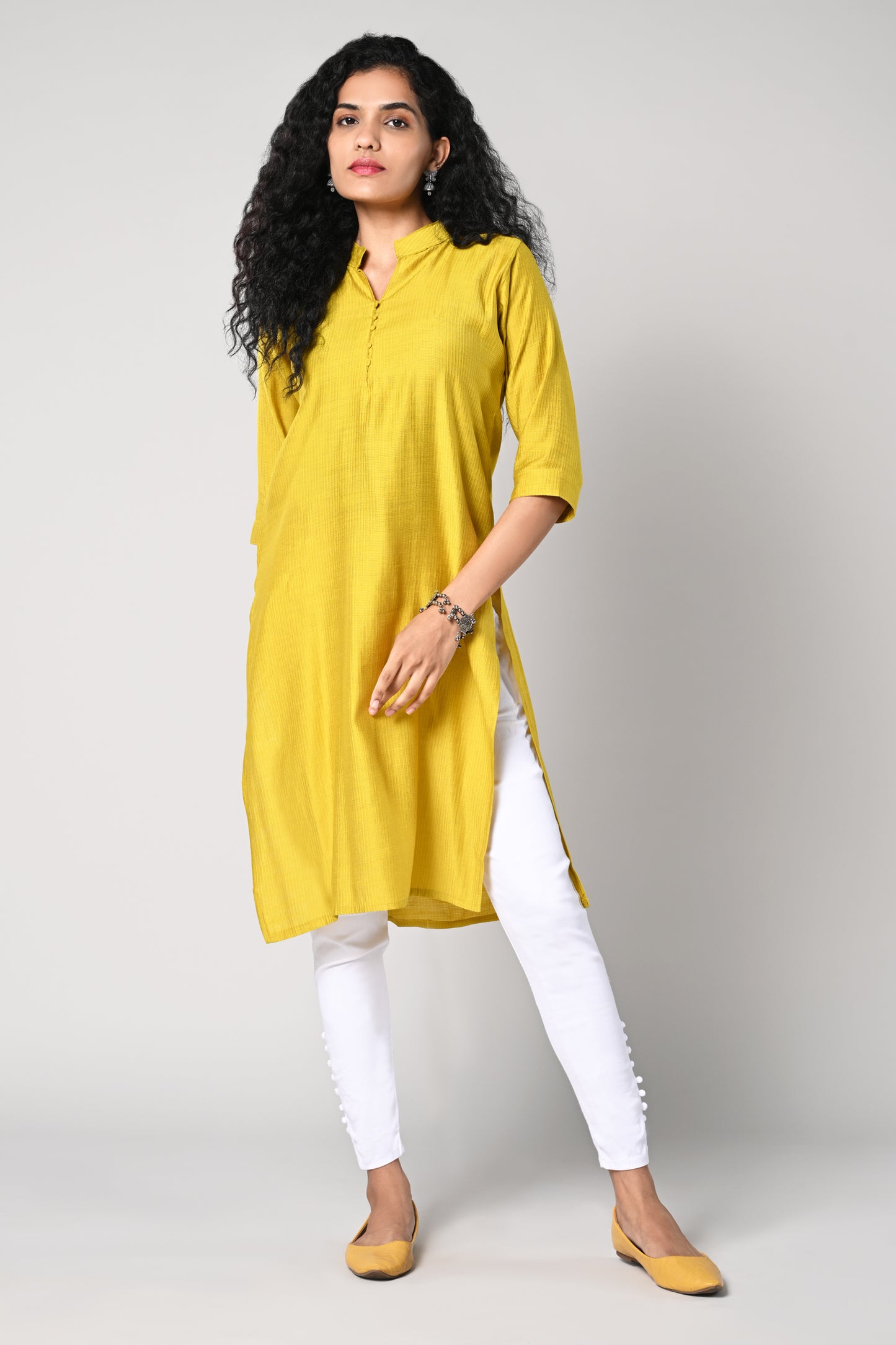 plain straight cut kurti with texture,
close neck &amp; v cut,
comes with 3/4 sleeves.