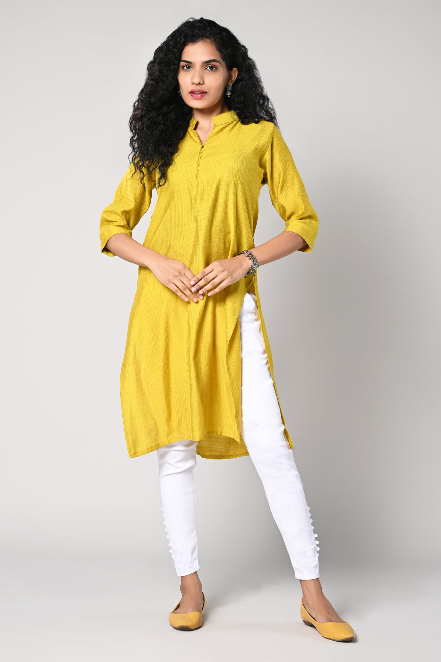 plain straight cut kurti with texture,
close neck &amp; v cut,
comes with 3/4 sleeves.