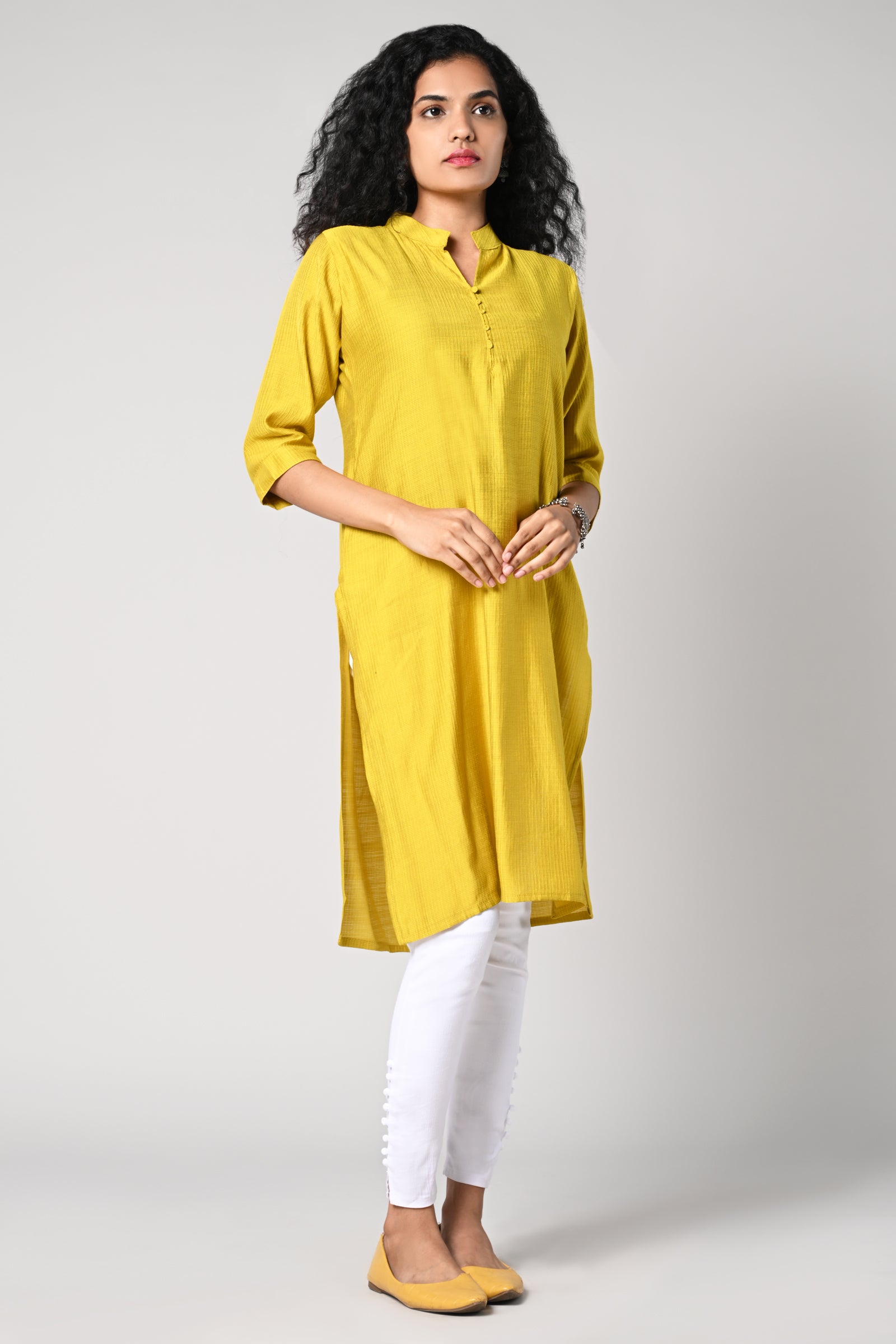 plain straight cut kurti with texture,
close neck &amp; v cut,
comes with 3/4 sleeves.