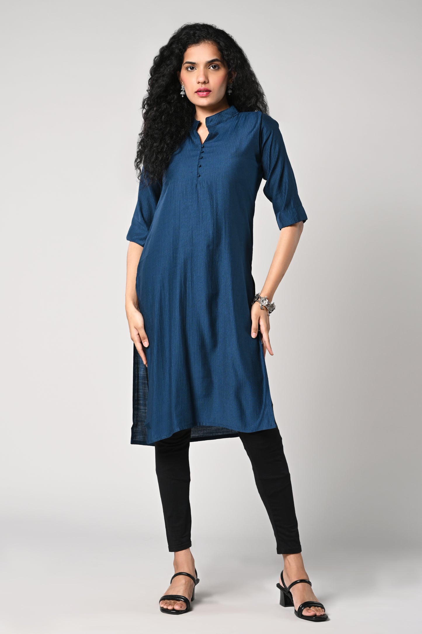 plain straight cut kurti with texture,
close neck &amp; v cut,
comes with 3/4 sleeves.